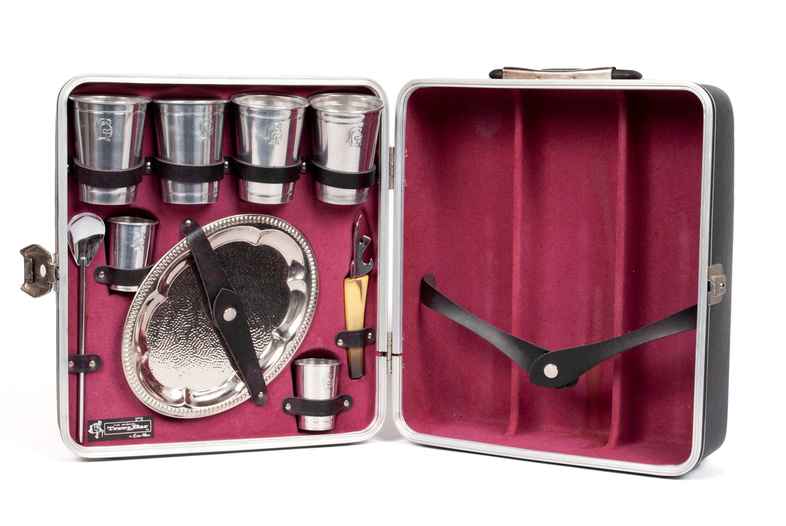 EVER-WEAR "TRAV-L-BAR" LIQUOR SET IN CASE: EVER-WEAR "TRAV-L-BAR" LIQUOR SET IN CASE American, 20th century. Executaire 707: a complete set in fitted hard case, lid fitted to receive three (3) liquor bottles. Includes four (4) glasse