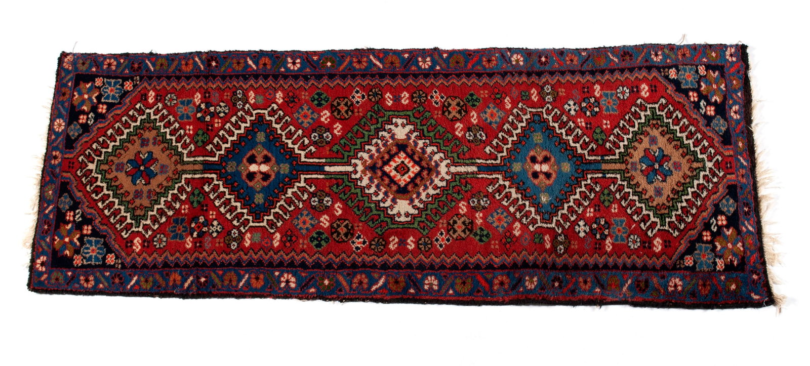 PERSIAN THROW RUG: PERSIAN THROW RUG Persian, mid-20th century. Five (5) latch hook medallions on the foliate decorated red field with navy corners, floral decorated royal blue border. 4 ft. 9 in. x 1 ft. 10 in.