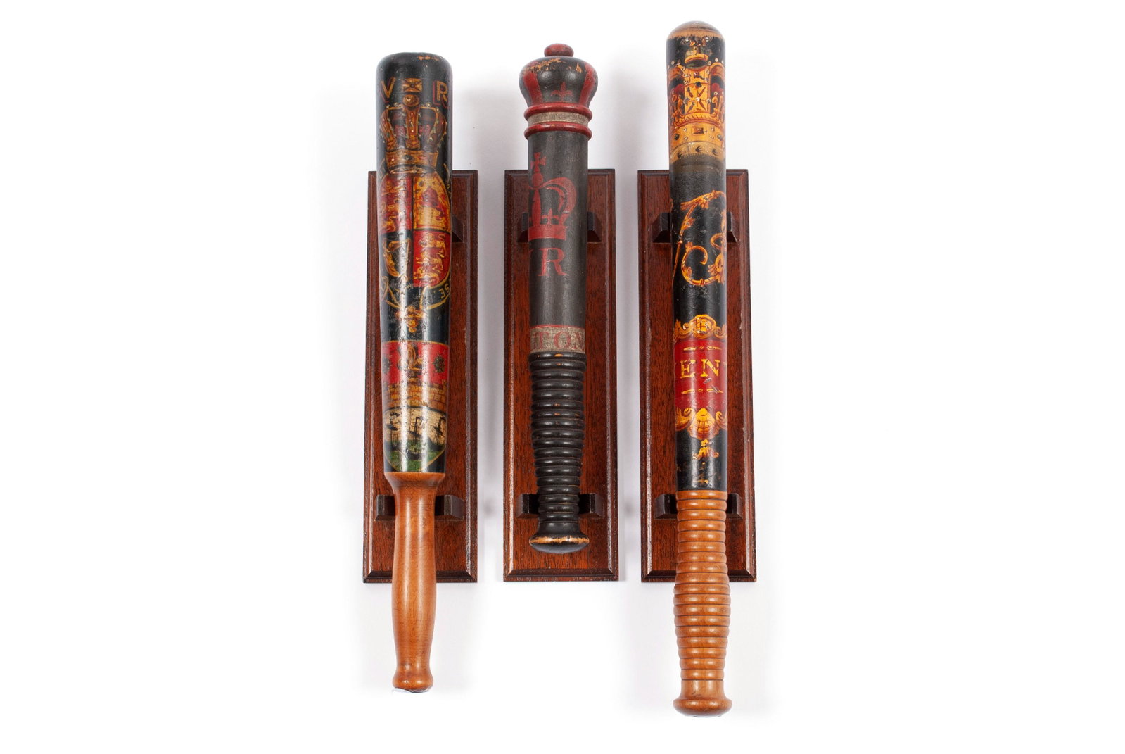 THREE VICTORIAN BOBBY BILLY CLUBS: THREE VICTORIAN BOBBY BILLY CLUBS All polychrome decorated for Queen Victoria's reign. The shortest painted "1838 - HOLTON" with carved crown tip end in red and black, another decorated with