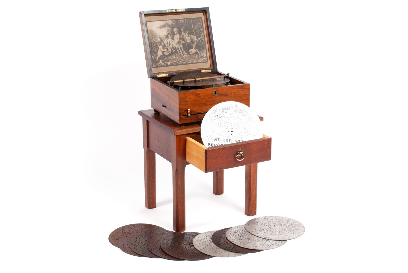 SYMPHONION MUSIC BOX: SYMPHONION MUSIC BOX Germany, early 20th century. Single comb mechanism playing fifteen 10" metal discs. Rosewood box with inlaid ivorine "Symphonion" (in script) to the top and original full size lab