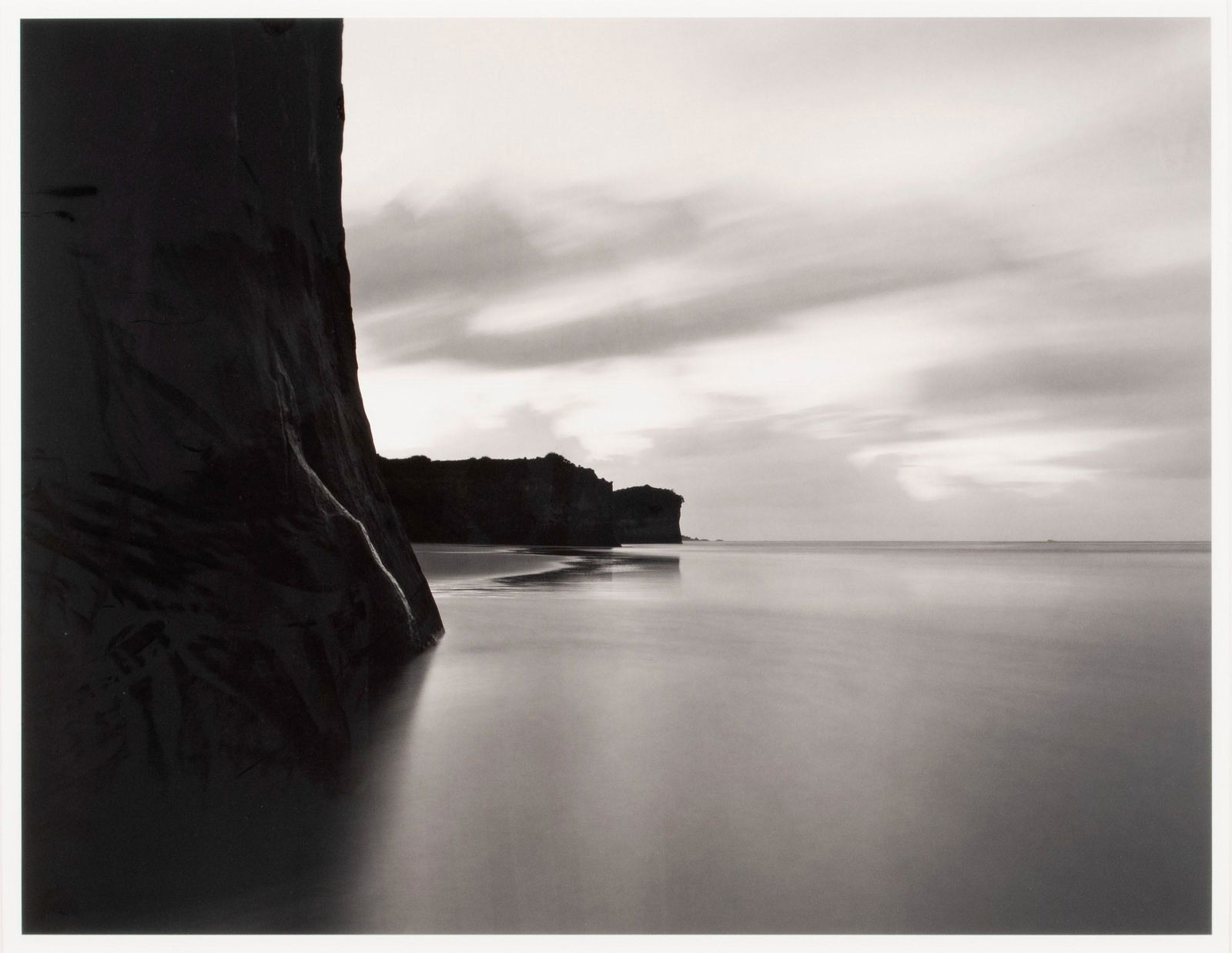 CHIP HOOPER (AMERICAN. B. 1962): Chip HooperAmerican, b. 1962Cape Foulwind Beach, Tasman Sea, New Zealand, 2003Silver gelatin printSigned and editioned 17/25 in pencil to verso of the print. View of an undisturbed shoreline in the sh