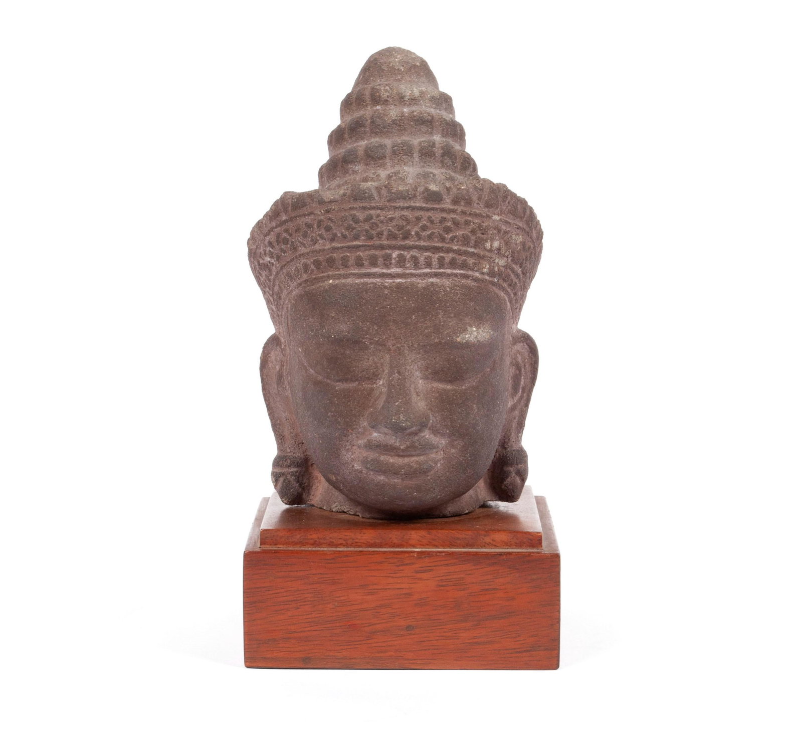 A KHMER CARVED DIETY HEAD: A KHMER CARVED DIETY HEAD Region of present-day Cambodia, 11th-13th century, schist. Angkorian carved head, accession numeral marks to underside. 6 1/2 in. (16.51 cm.); overall 8 1/2 in. (21.59 cm.)