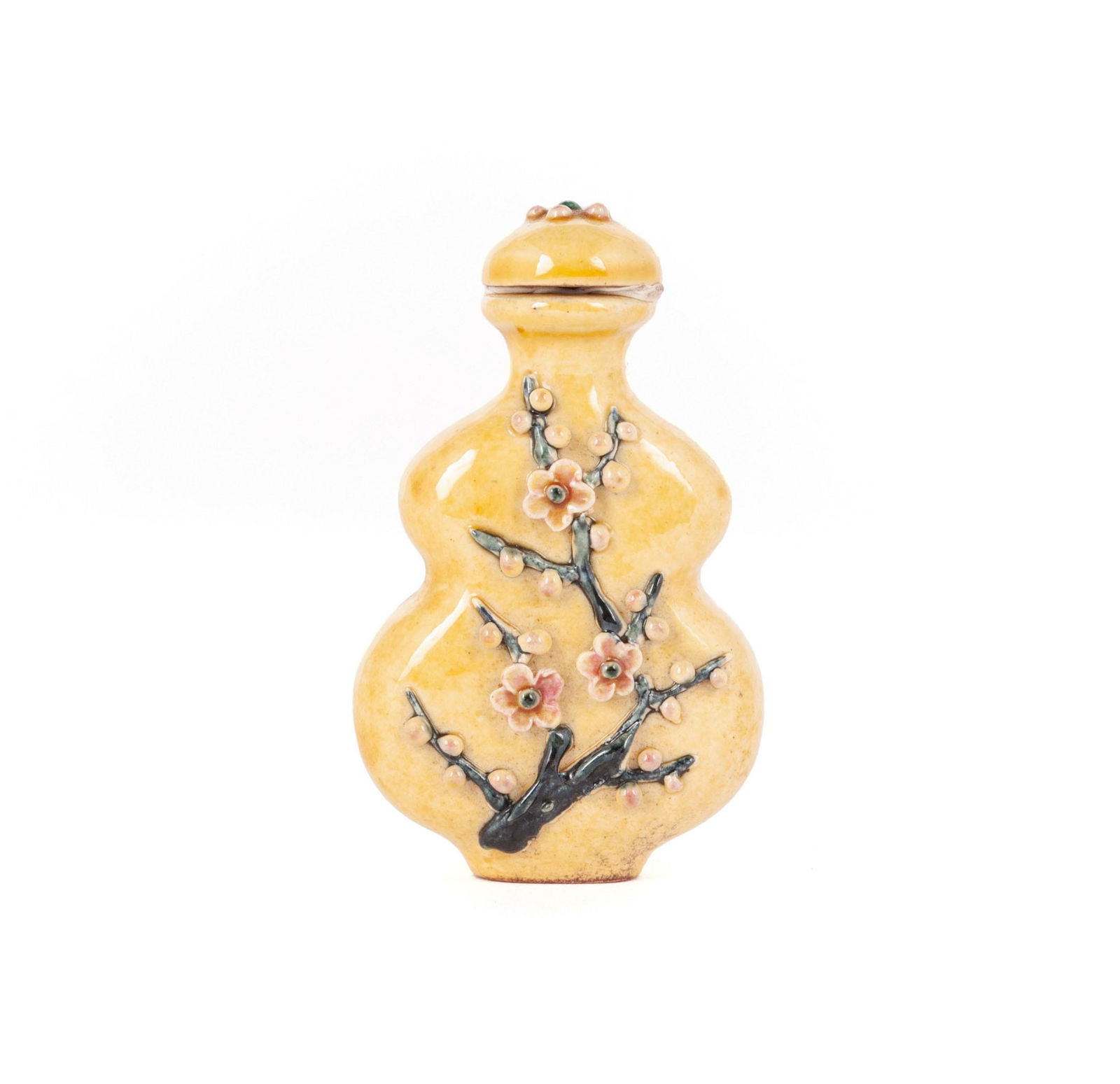 A YELLOW GROUND PRUNUS RELIEF SNUFF BOTTLE (1 of 7)