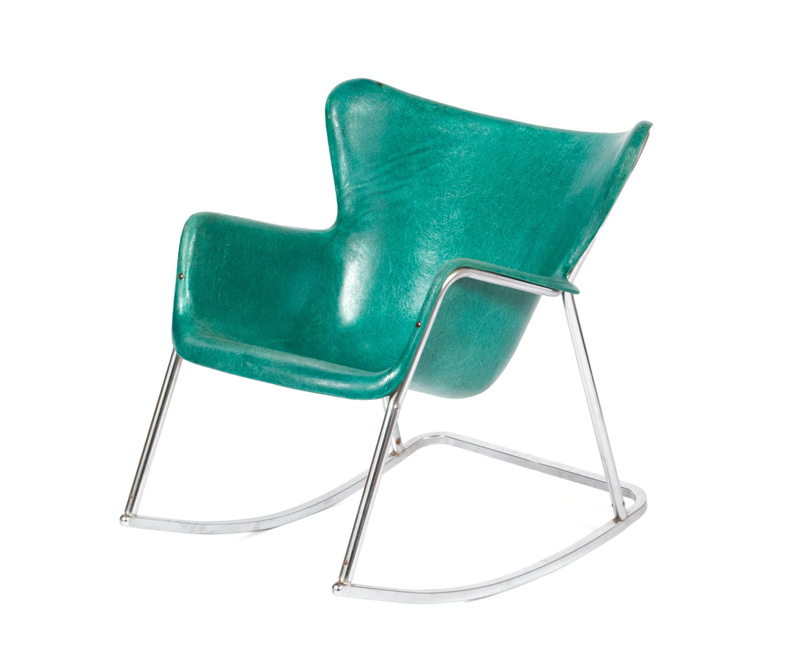 LAWRENCE PEABODY FOR SELIG FIBERGLASS ROCKING CHAIR: LAWRENCE PEABODY FOR SELIG FIBERGLASS ROCKING CHAIRAmerican, 1950's. The fiberglass, wingback seat in a forest green tone, mounted on the chrome rocking frame.31 x 27 1/2 in. (78.74 x 69.85 cm.)