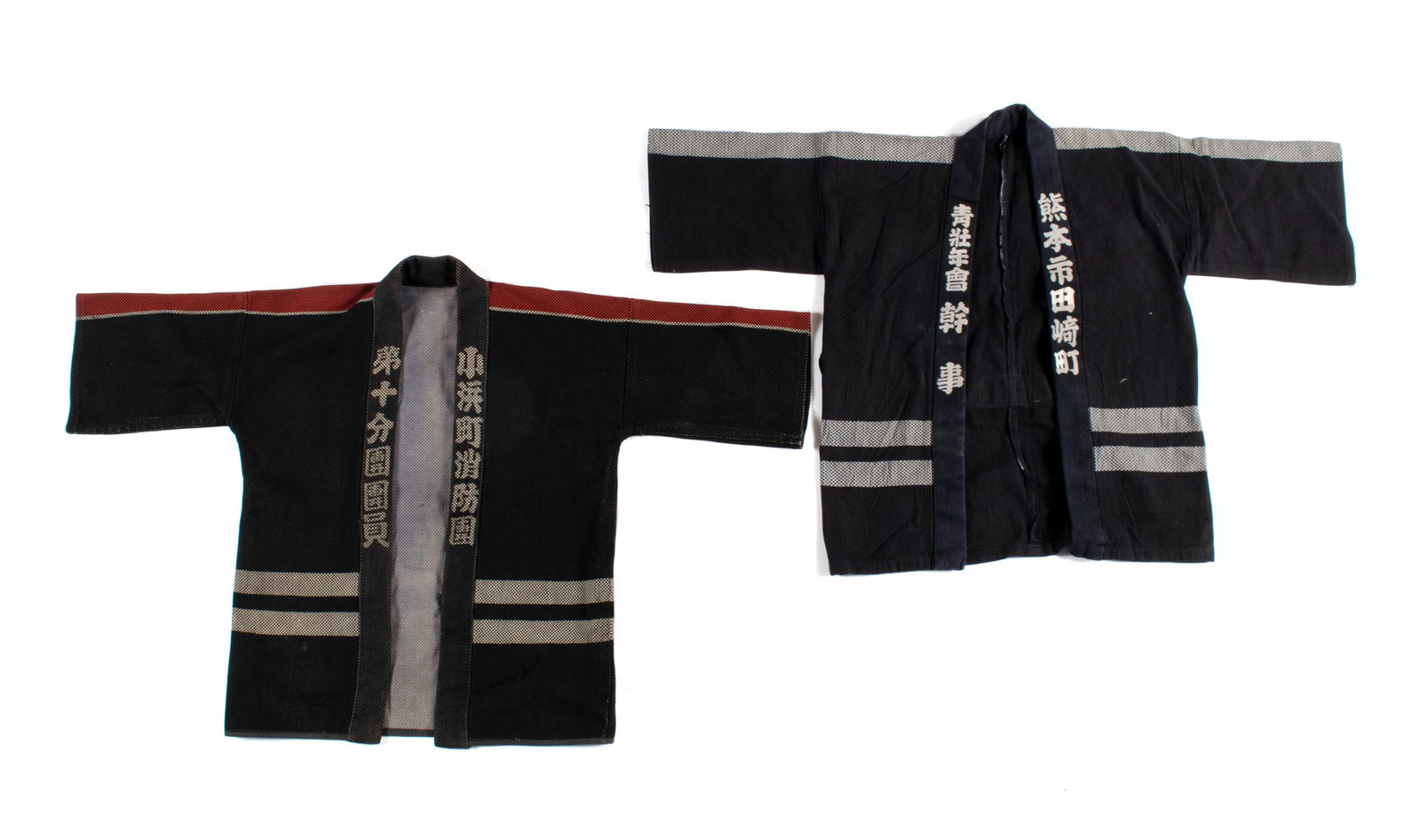 PAIRING OF JAPANESE FIREMEN'S COATS: PAIRING OF JAPANESE FIREMEN'S COATS Japanese, mid-20th century. Full sleeve with back emblem and kanji script lapels.