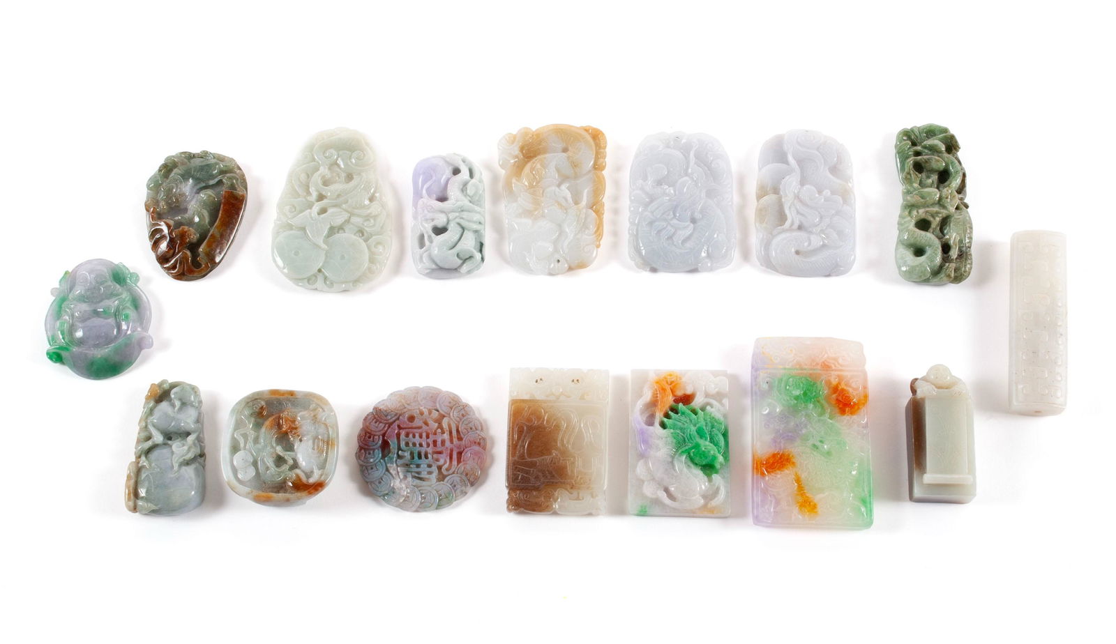 COLLECTION OF COLORED HARDSTONE CARVINGS AND DISCS: COLLECTION OF COLORED HARDSTONE CARVINGS AND DISCSChinese, 20th century, hardstone. Sixteen (16) pieces total, color treated, of varying motifs.Longest: 3 in. (7.6 cm.)