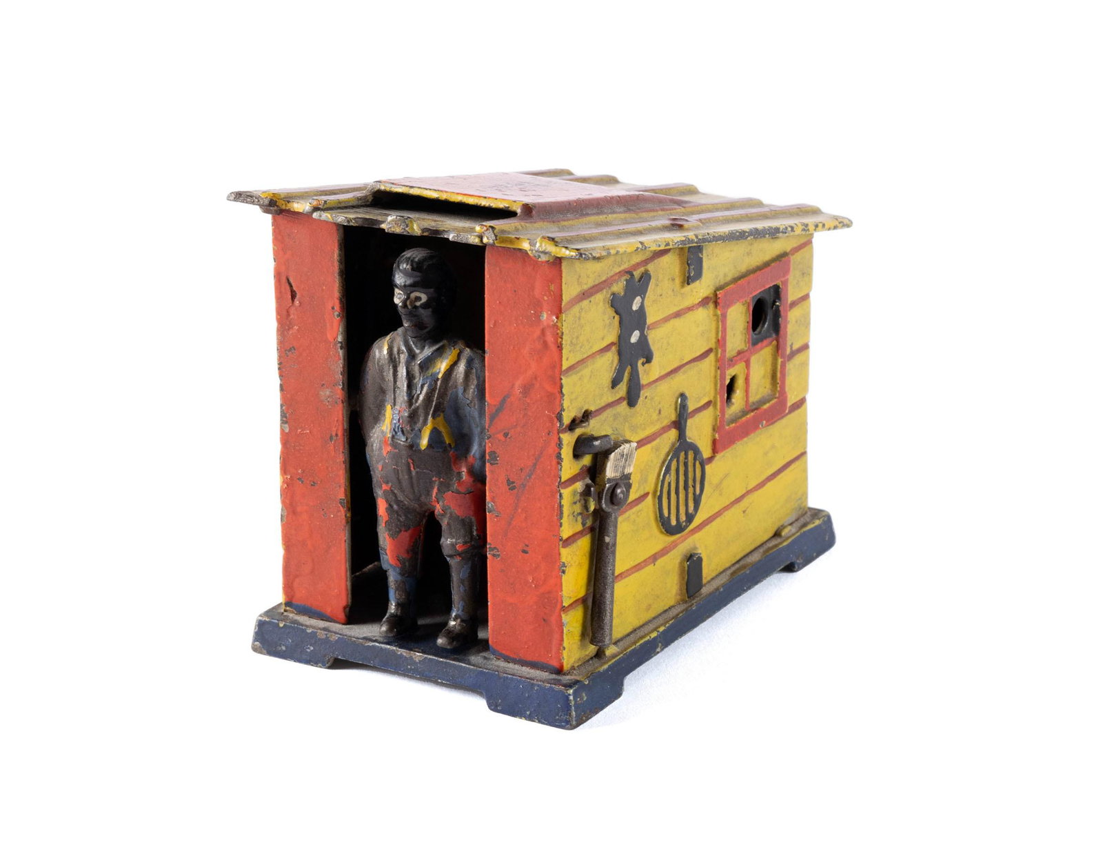 "DARKY AND THE CABIN" IRON TOY BANK: "DARKY AND THE CABIN" IRON TOY BANK American (Connecticut), early 20th century, iron. Manufactured by J & E. Stevens Company, in the form of a shed with Black Americana figure receiving the 