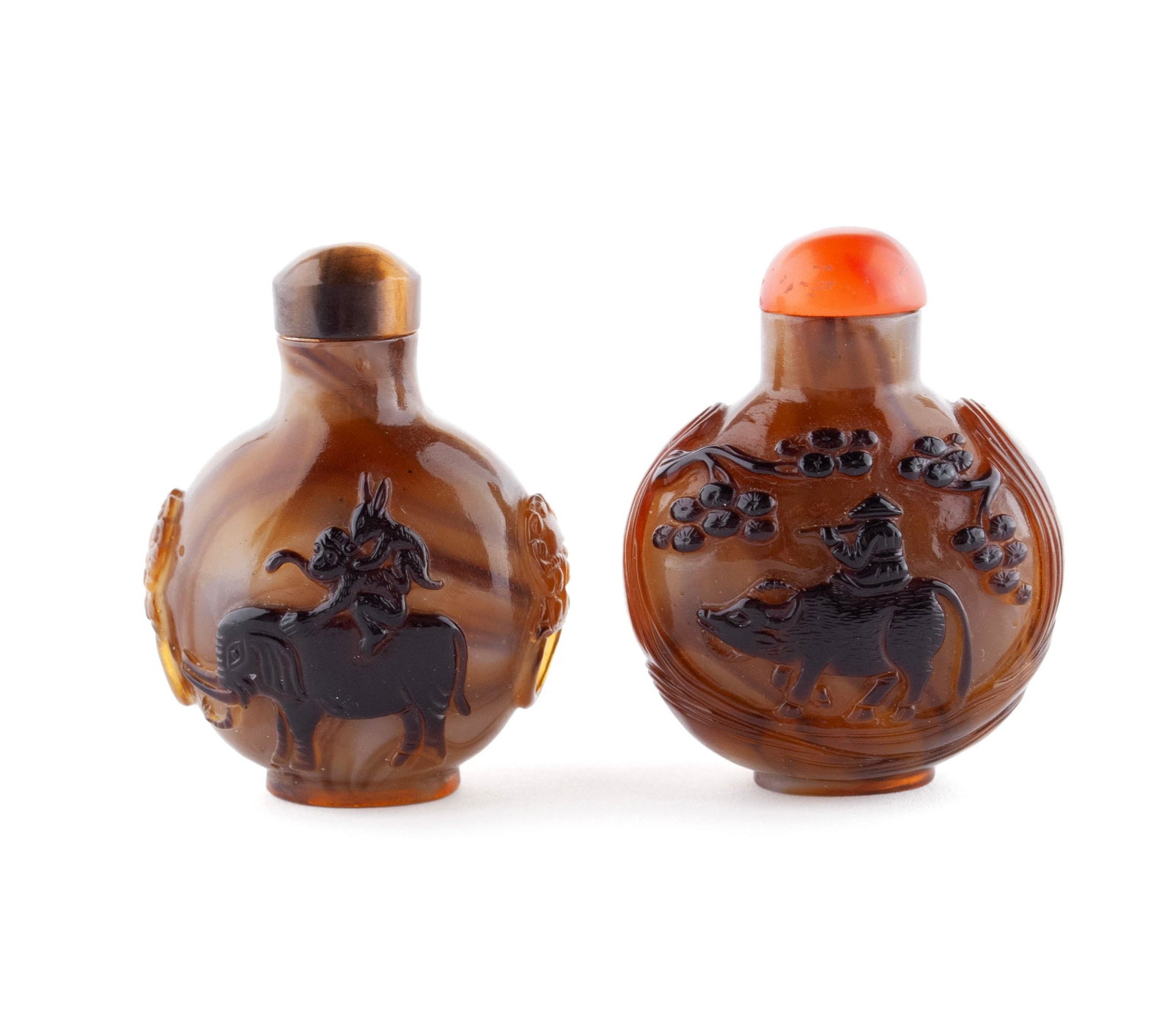 TWO IMITATION SHADOW AGATE GLASS CARVED SNUFF BOTTLES: TWO IMITATION SHADOW AGATE GLASS CARVED SNUFF BOTTLES Chinese, early to mid-20th century, glass. A rabbit on the back of a monkey atop an elephant opposes a monkey atop horseback to this unusual bottl