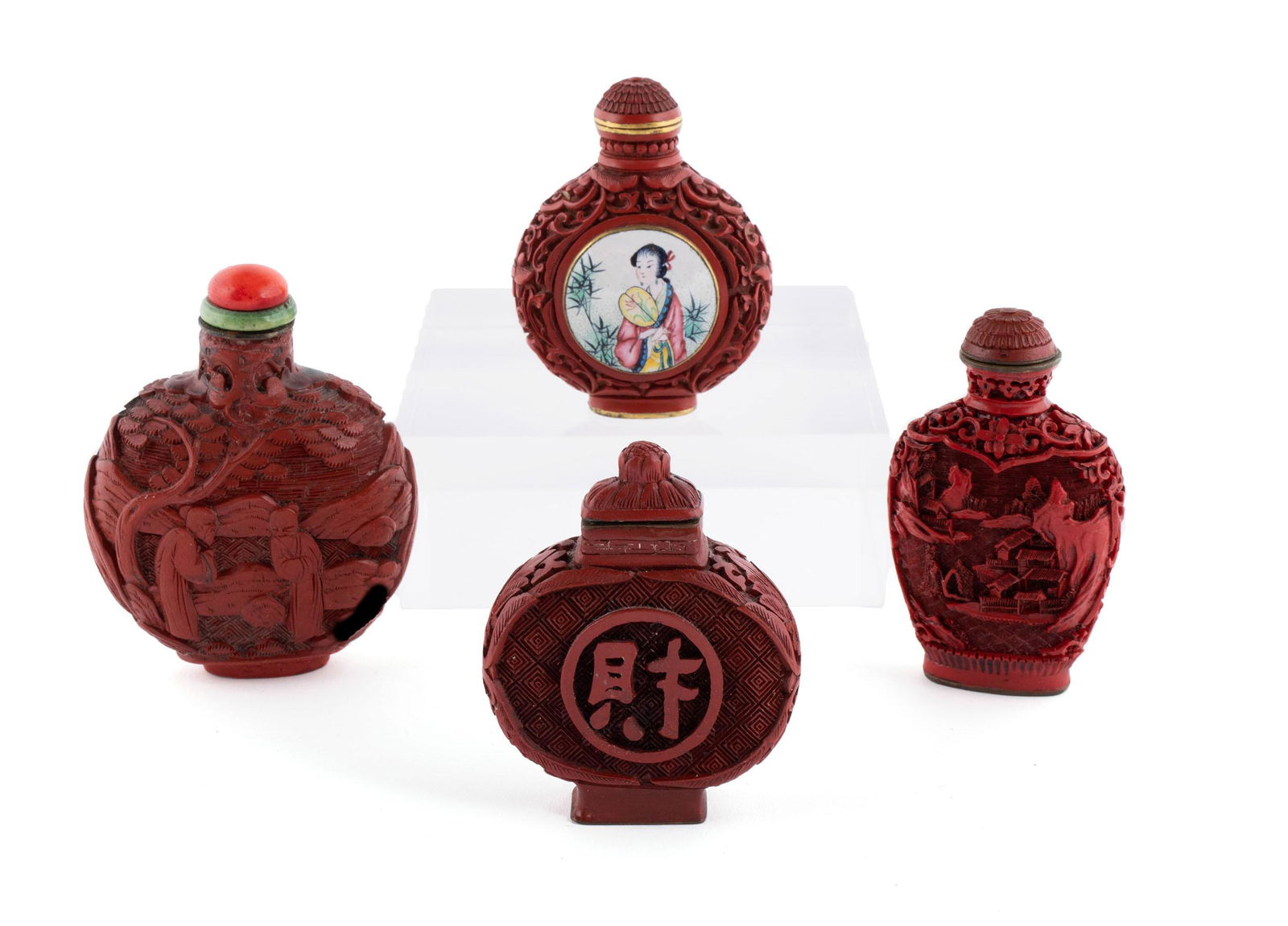 FOUR RED LACQUERED SNUFF BOTTLES (1 of 5)