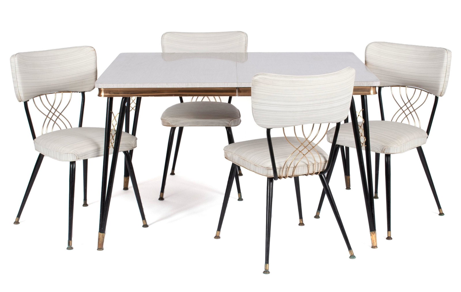 CHROMCRAFT MCM DINETTE SET: CHROMCRAFT MCM DINETTE SETAmerican, mid-century modern. The white Formica table with a single leaf, accompanied by four (4) chairs with white upholstery, brass highlights, and splayed, ebonized legs.T