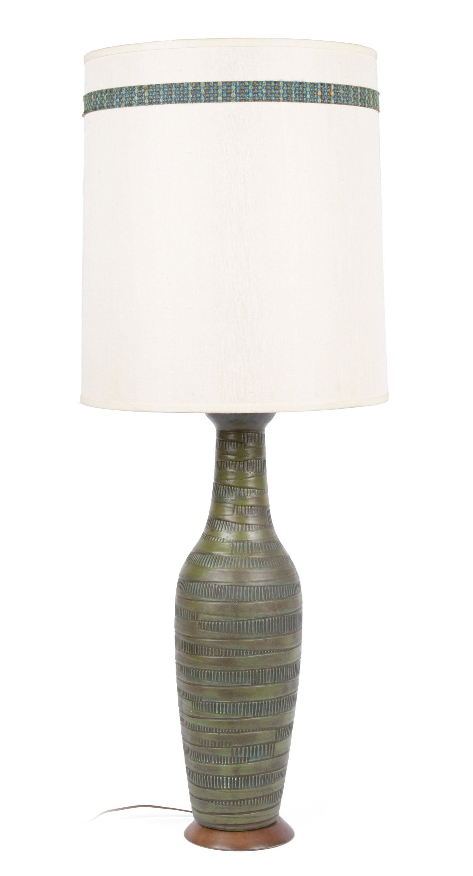 LEE ROSEN FOR DESIGN TECHNICS MCM TABLE LAMP: LEE ROSEN FOR DESIGN TECHNICS MCM TABLE LAMPAmerican, mid-20th century, ceramic. In vase form, glazed in blue-green, the original shade with matching, embroidered band.35.7 x 15 in. (90.7 x 38.1 cm.)