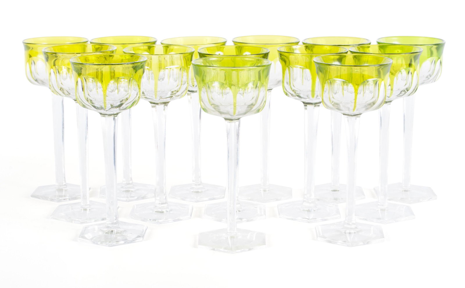 SET OF BACCARAT 'MALMAISON' RHINE WINE HOCKS: SET OF BACCARAT 'MALMAISON' RHINE WINE HOCKS French, circa 1910, crystal. Fourteen (14) articles of stemware of yellow-green overlay and hexagonal termination. 7 1/2 in. (19.1 cm.)