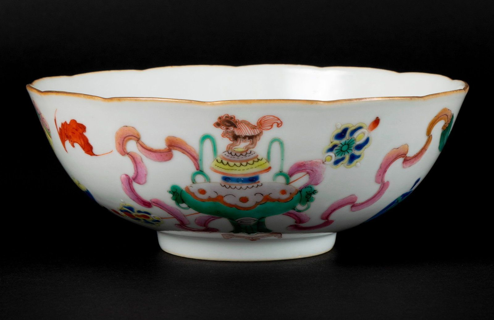 KAKIEMON BOWL: KAKIEMON BOWL Japanese, 19th century, porcelain. Earthtone scalloped rim above peach painted well, the exterior walls decorated with bats and beribboned auspicious symbols in Chinese fashion, four-cha