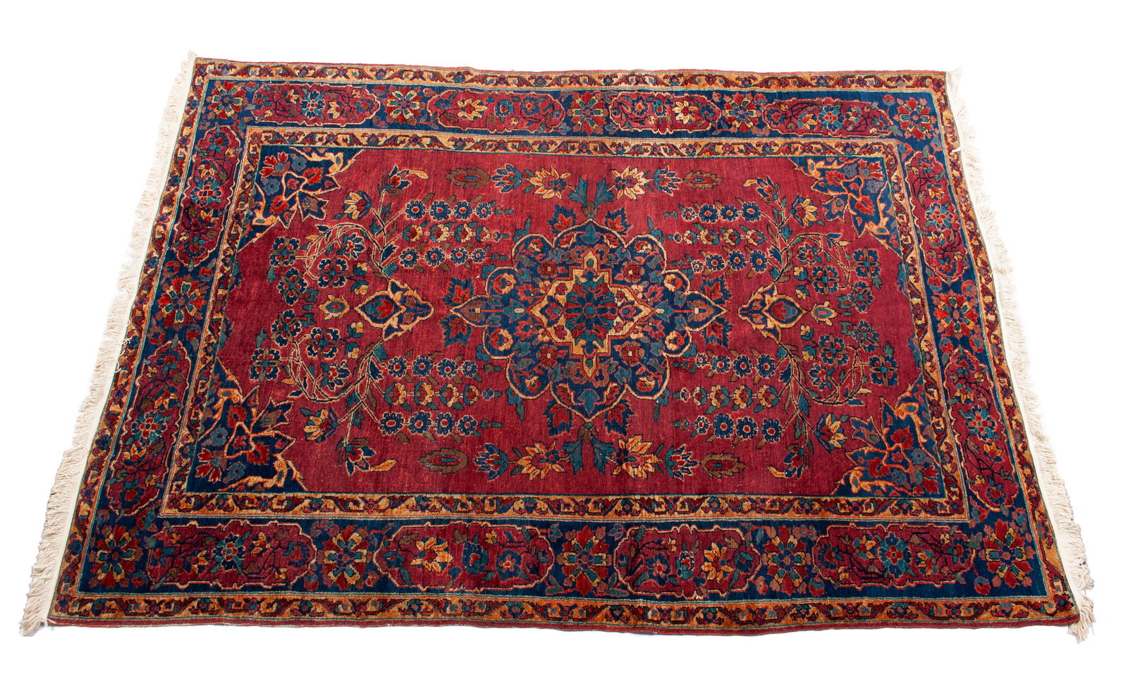 FARAHAN SAROUK HALL RUG: FARAHAN SAROUK HALL RUGPersian, late 19th to early 20th century. Navy foliate medallions with matching corners around the floral decorated red field, navy border with beige guard borders.8 ft. 6 in. x