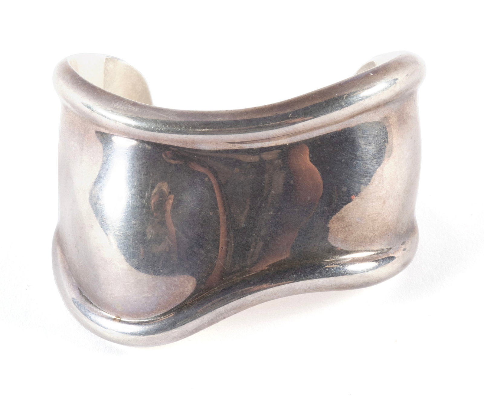 ELSA PERETTI FOR TIFFANY & CO. BONE CUFF: ELSA PERETTI FOR TIFFANY & CO. BONE CUFF The bracelet in sterling silver, stamped Tiffany & Co.; 925; Italy and the Peretti signature to the inside. Accompanied by the original Tiffany & Co. bag. 57 g