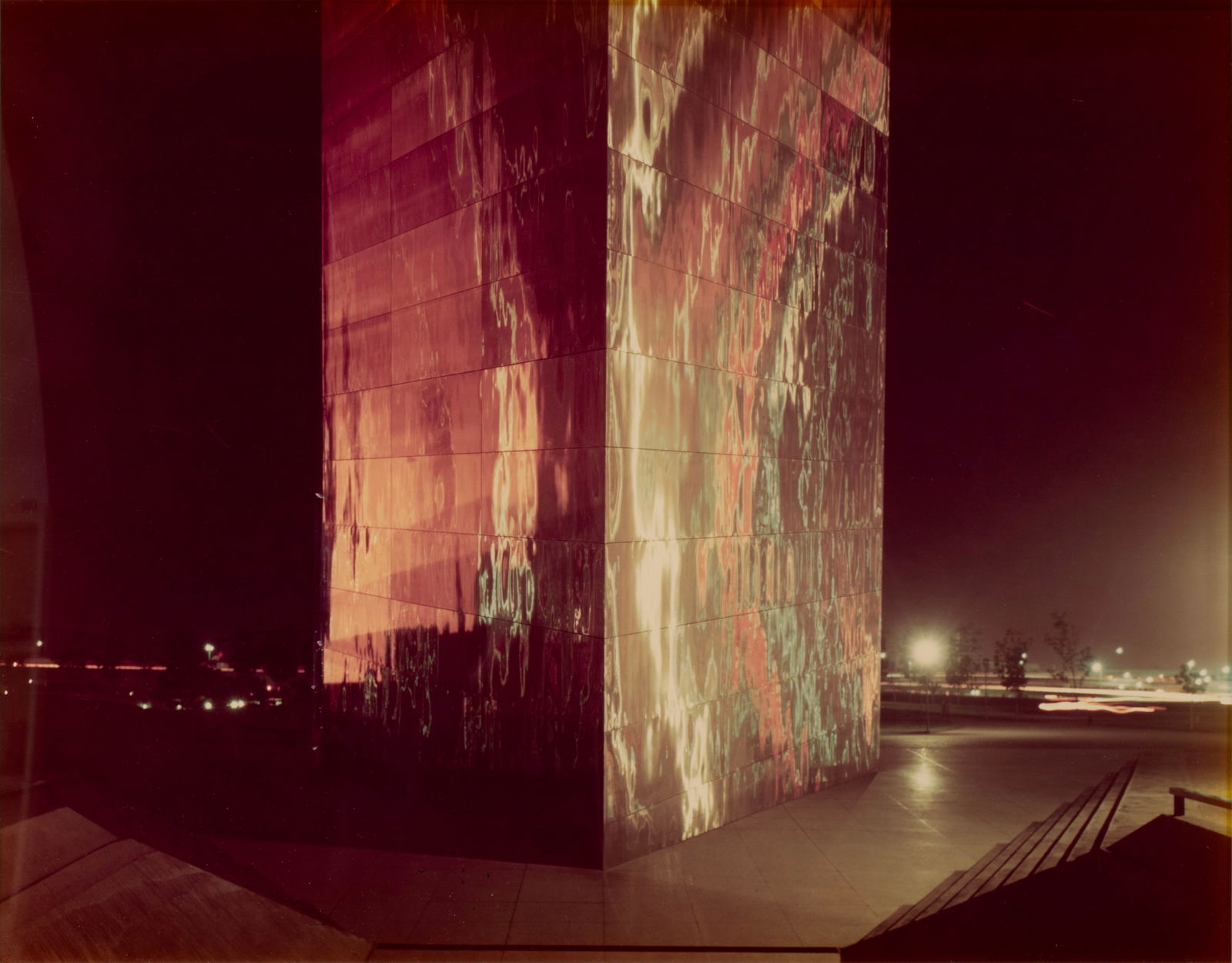 JOEL MEYEROWITZ (AMERICAN, B. 1938): Joel MeyerowitzAmerican, b. 1938St. Louis Arch, c. 1979Color photograph, signed to versoView by night of one leg of the Gateway Arch on the Mississippi riverfront in downtown St. Louis; behind glass a
