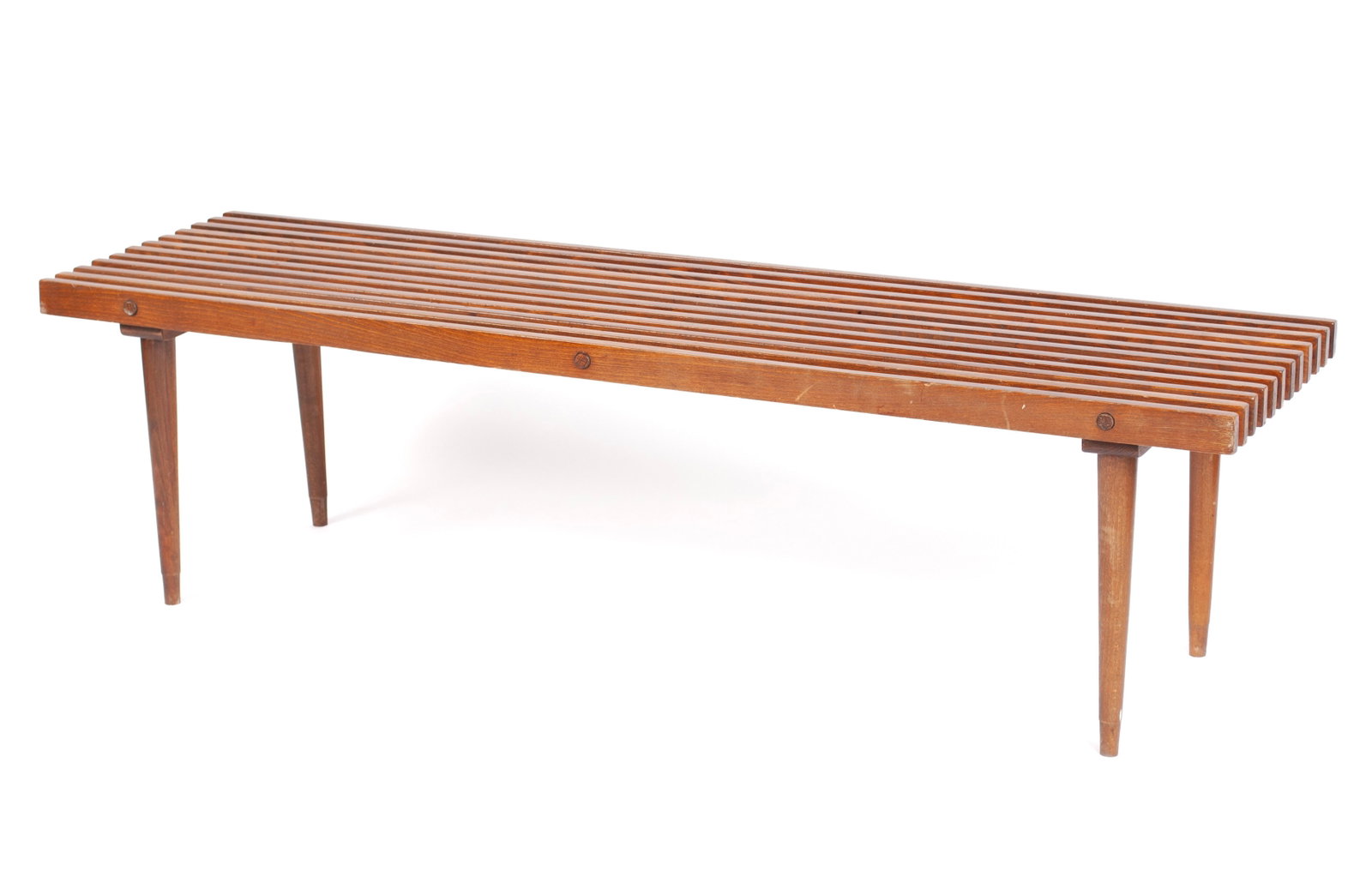 SLAT BENCH IN THE MANNER OF GEORGE NELSON: SLAT BENCH IN THE MANNER OF GEORGE NELSON American, 20th century, oak. Slatted surface on tapering legs; unmarked. 16 3/4 x 17 1/4 x 60 in. (42.5 x 43.8 x 152.4 cm.)
