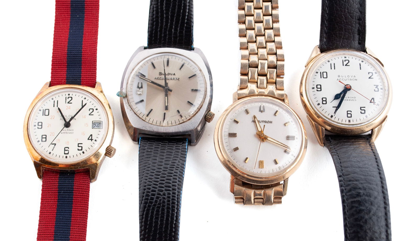 FOUR VINTAGE BULOVA MEN'S WRISTWATCHES: FOUR VINTAGE BULOVA MEN'S WRISTWATCHESFour (4) Bulova watches: a gold filled "Railroad Approved" Accutron, a gold filled Accutron with metal strap, a stainless steel Accuquartz, and a base m