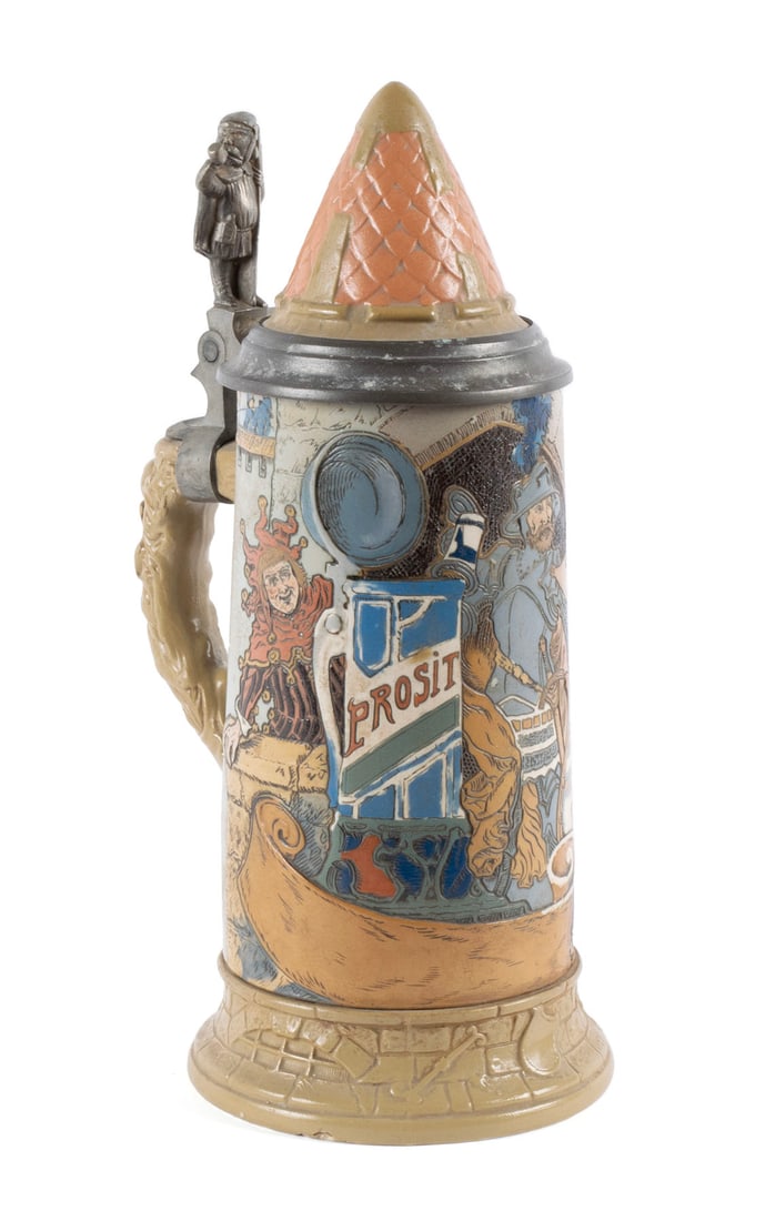 METTLACH STEIN #2580: METTLACH STEIN #2580 German, early 20th century, stoneware. Depicting a knight at a castle party, signed Heinr. Schlitt within the incised design. 10 in. (25.4 cm.) Bevo Mill, St. Louis, MO Robert Don