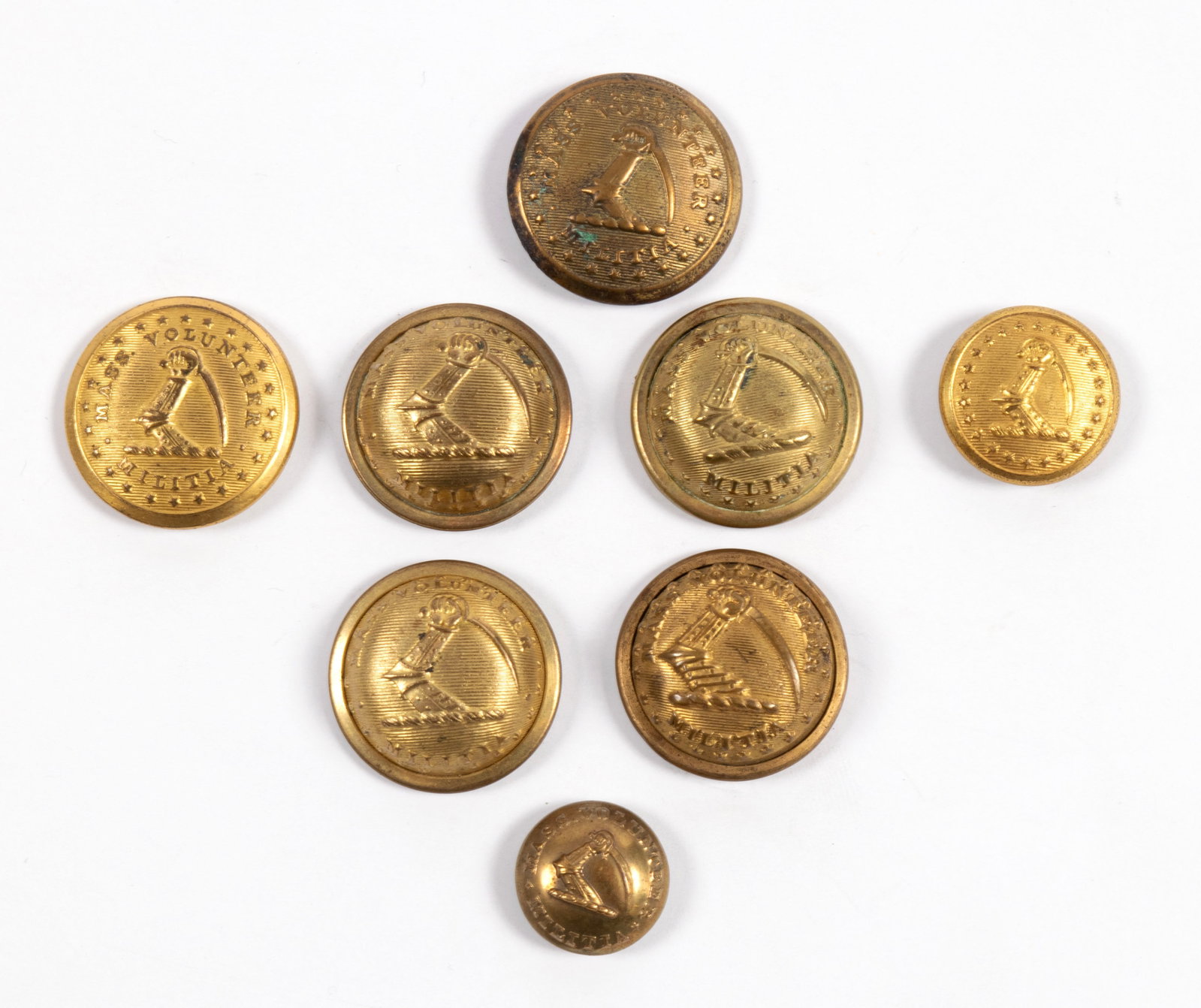 EIGHT MASSACHUSETTS VOLUNTEER MILITIA BUTTONS: EIGHT MASSACHUSETTS VOLUNTEER MILITIA BUTTONS American, 19th century. Eight (8) assorted buttons including Waterbury, Wm. H. Smith, Robinson, D. Evans, and Scoville. From the Collection of John F. Bra