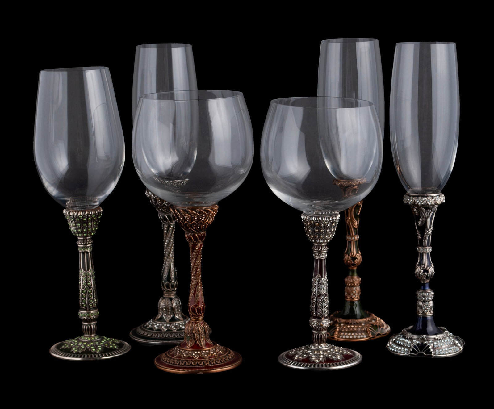 SIX PIECES EDGAR BEREBI STEMWARE: SIX PIECES EDGAR BEREBI STEMWARE American, 20th century. An assortment of wine and champagne glasses, the stems bejeweled and enameled with gold and silver plate finish. All glass bowls are removeable