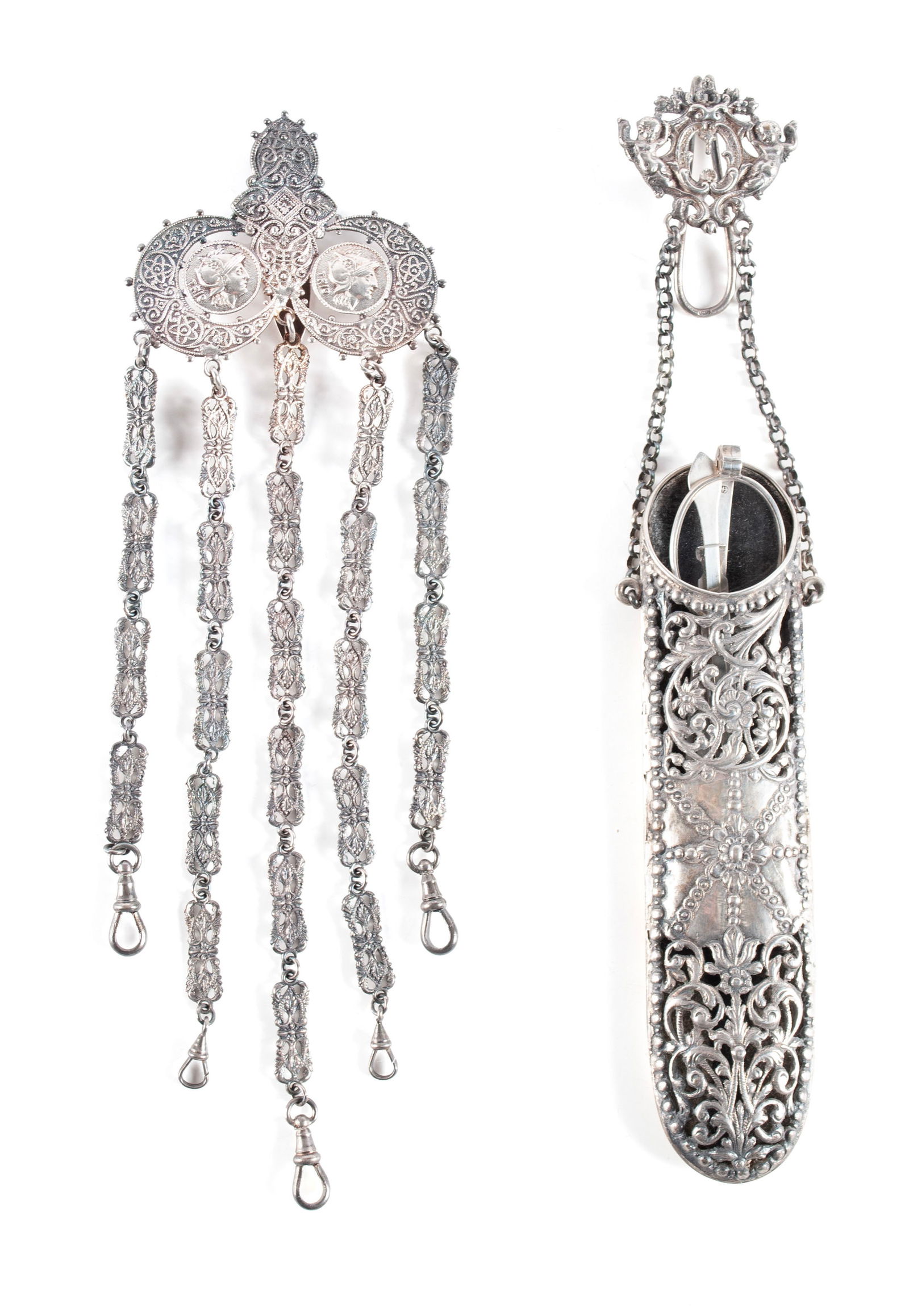 THREE PIECES WITH CHATELAINES AND SPECTACLES: THREE PIECES WITH CHATELAINES AND SPECTACLESEnglish, 19th century. Elaborate five-armed chatelaine incorporating medallions and crescent moon forms to the top hook, together with an "800" si