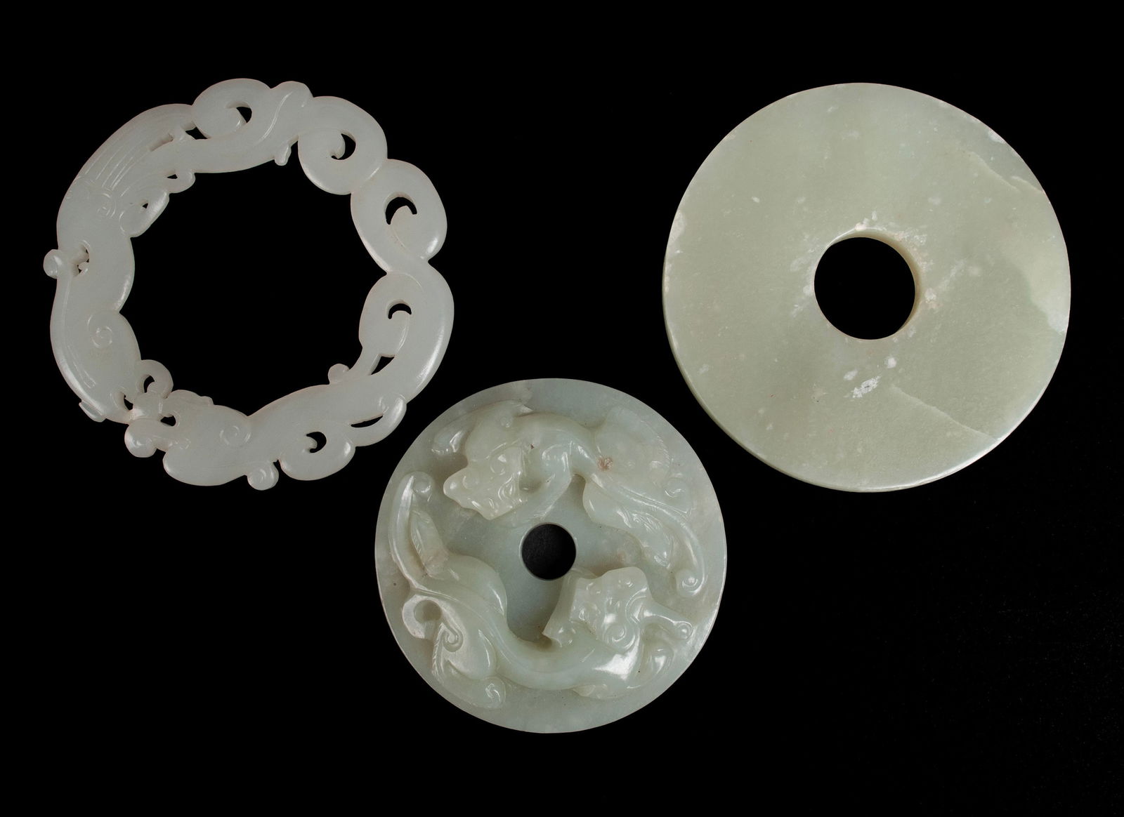 THREE CIRCULAR JADE CARVINGS (1 of 10)