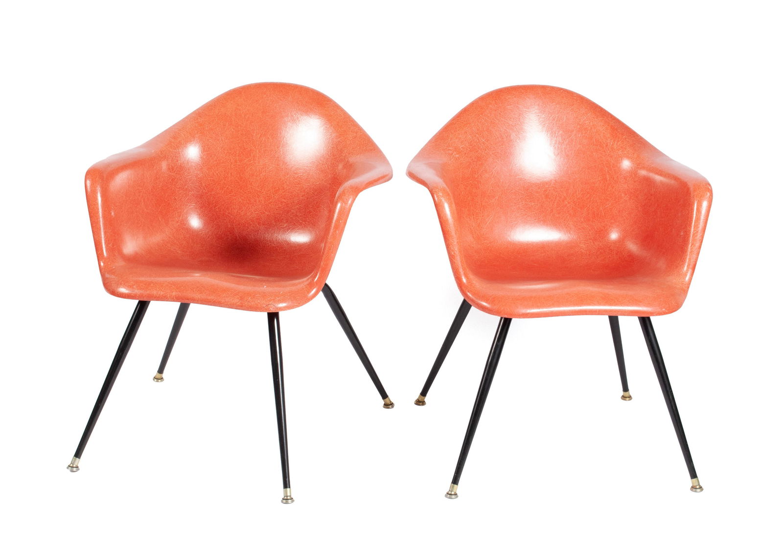 PAIR OF CHROMCRAFT FIBERGLASS ARMCHAIRS: PAIR OF CHROMCRAFT FIBERGLASS ARMCHAIRSAmerican, mid-20th century, signed in the mold to the bottom. Coral color on black metal legs.30 1/4 x 24 x 25 1/2 in. (76.8 x 61 x 64.8 cm.)