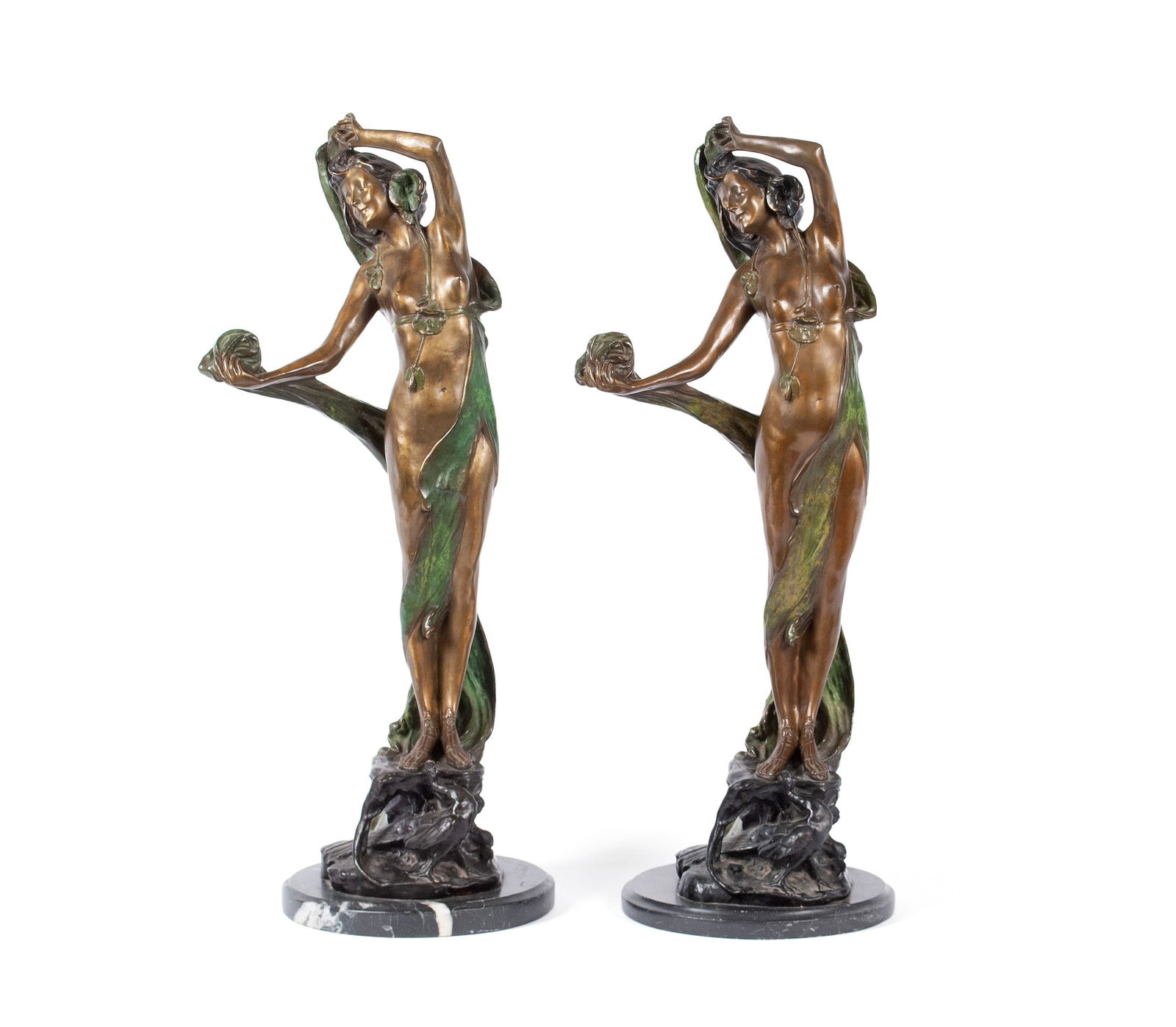 PAIR OF ART NOUVEAU STYLE BRONZES AFTER VITTORIO CARADOSSI: PAIR OF ART NOUVEAU STYLE BRONZES AFTER VITTORIO CARADOSSI20th Century. A matching pair of standing female nudes, a peacock at their feet, on a marble base.33 x 13 x 12 in. (83.8 x 33 x 30.5 cm.)