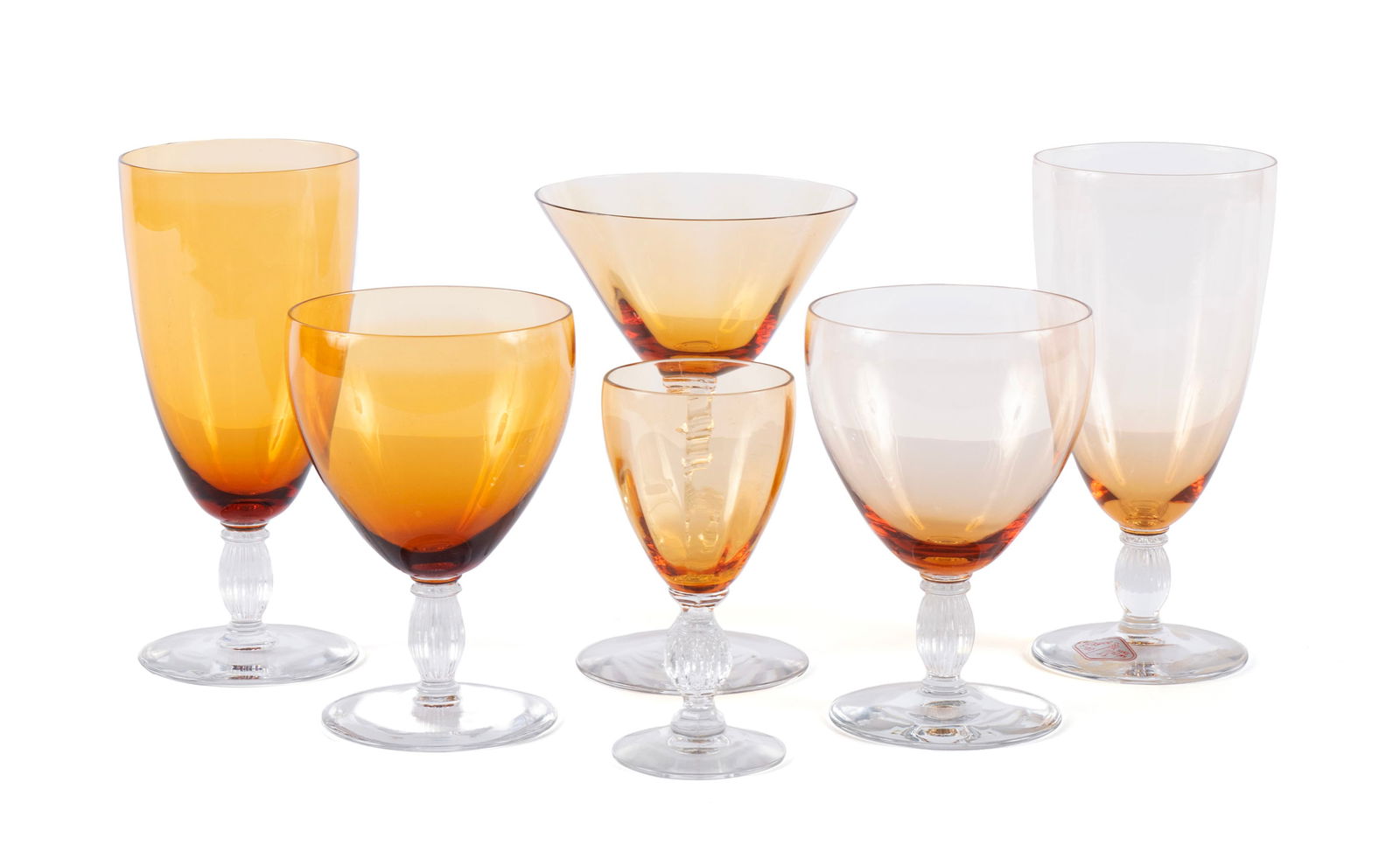 COLLECTION OF AMBER GLASS STEMWARE (28): COLLECTION OF AMBER GLASS STEMWARE (28)Twenty-eight (28) total. Including nine (9) wine glasses and ten (10) water goblets by Bryce, five (5) champagne glasses and four (4) Cambridge cordials.Largest: