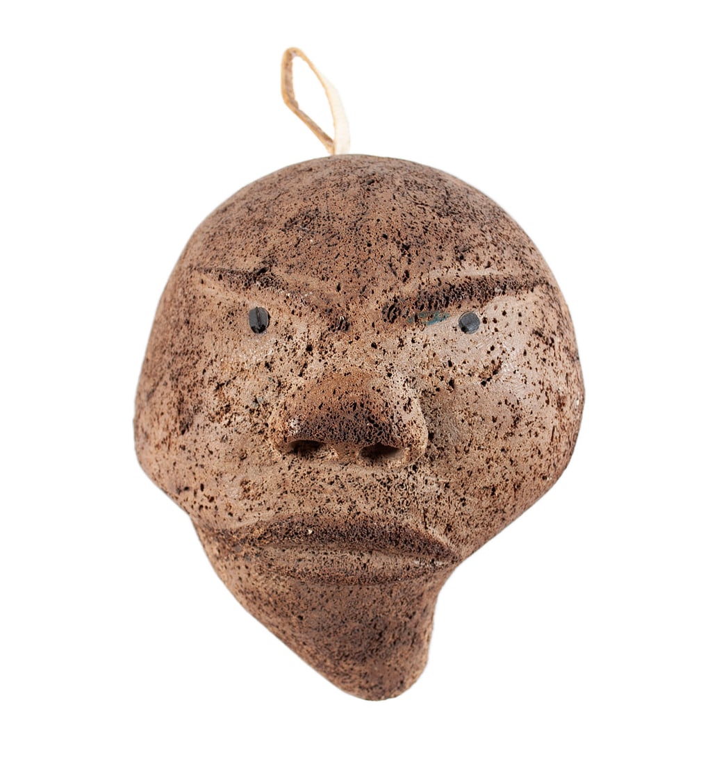 INUPIAQ / INUIT WHALE BONE MASK: INUPIAQ / INUIT WHALE BONE MASK First Nations, Pacific West Coast, Alaska or Canada, 20th century, carved ossified porous whale bone moon spirit mask. 6 1/2 x 5 1/4 x 3 1/4 in. (16.5 x 13.3 x 8.3 cm.)