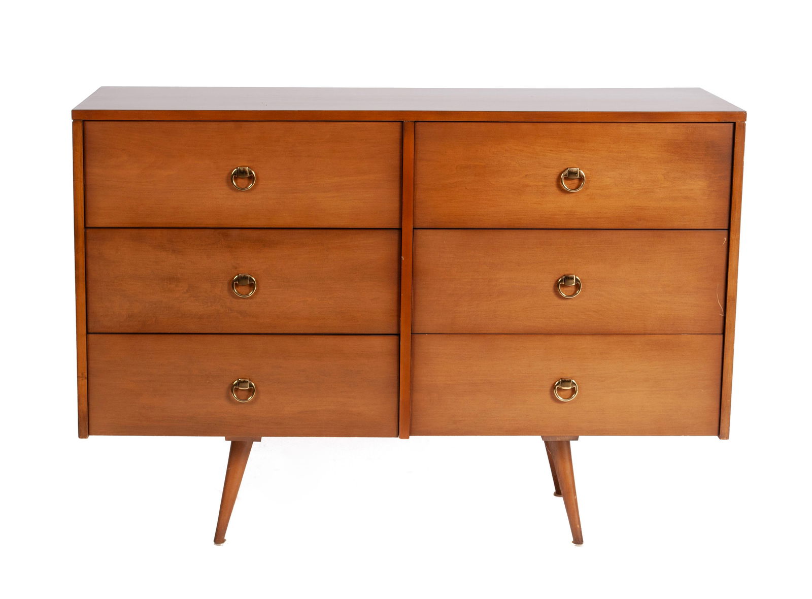 PAUL MCCOBB PLANNER GROUP SIX DRAWER DRESSER: PAUL MCCOBB PLANNER GROUP SIX DRAWER DRESSERAmerican, 1951, birch, labeled. Rectangular case with six short drawers on four tapering legs.33 x 18 x 48 in. (83.8 x 45.7 x 121.9 cm.) Provenance: From th