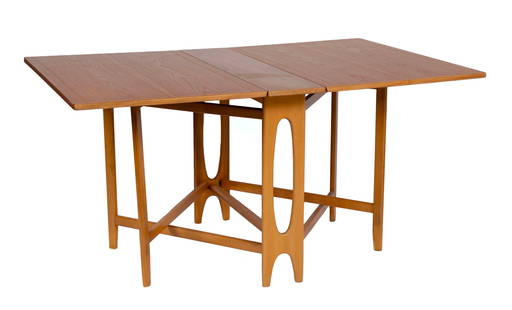 BENDT WINGE FOR KLEPPES MOBELFABRIK NR.4 ECLIPSE TABLE: BENDT WINGE FOR KLEPPES MOBELFABRIK NR.4 ECLIPSE TABLENorway, 1963. Teak drop leaf table having elliptical side support, the leaves resting on gateleg crosses supports.29 x 59 x 34 1/2 in. (73.7 x 149