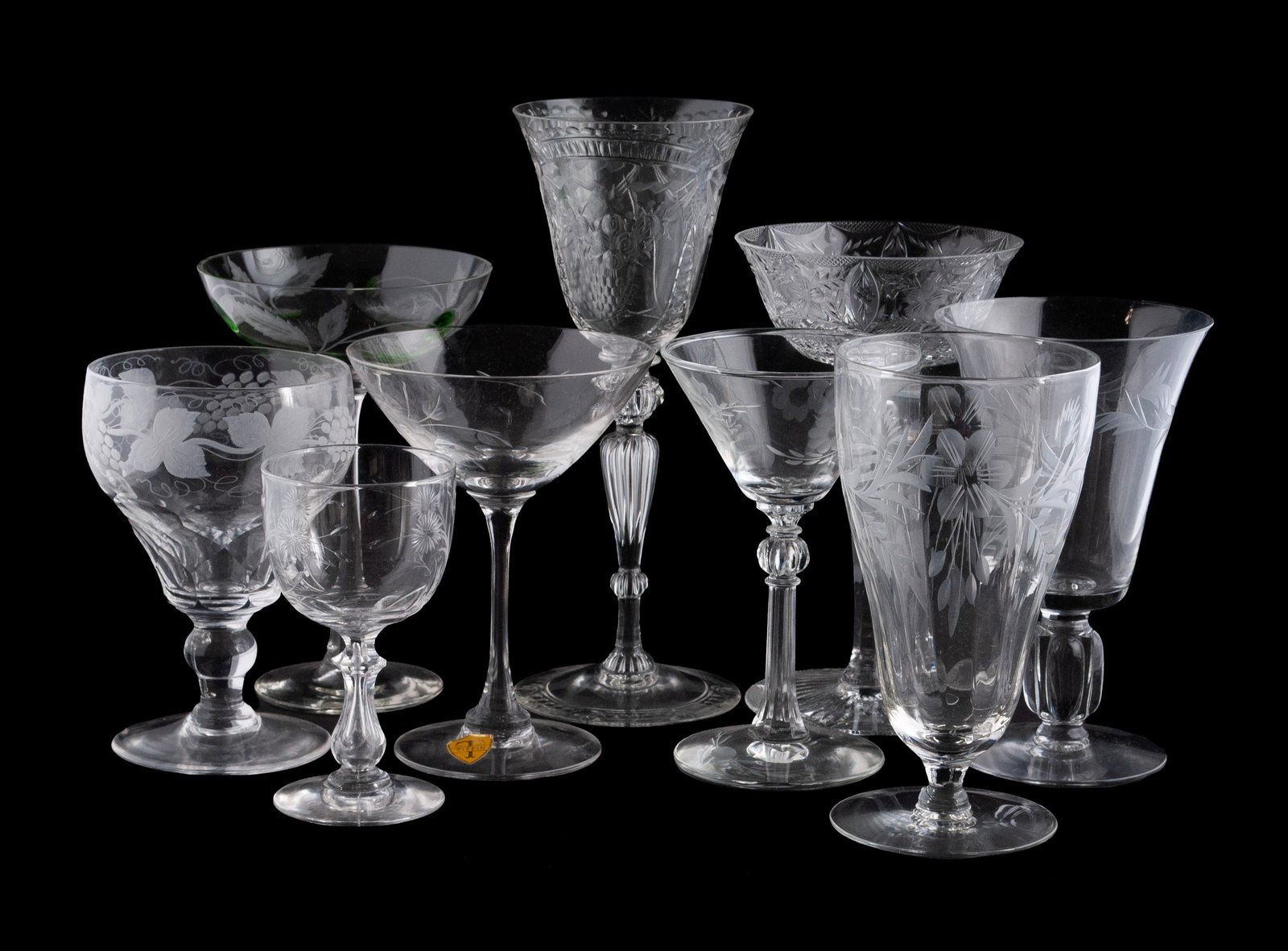 COLLECTION OF ETCHED GLASS STEMWARE (31): COLLECTION OF ETCHED GLASS STEMWARE (31) Thirty-one (31) pieces total of assorted stemware, including water goblets, wine stems and cordials of varying form and decoration. Largest: 8 3/4 in. (22.2 cm