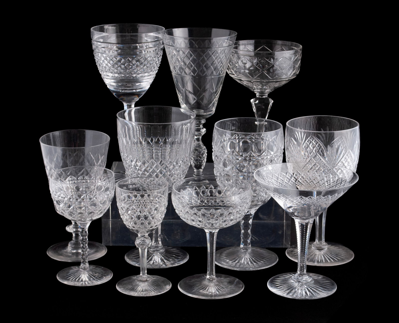 COLLECTION OF CUT GLASS STEMWARE (32): COLLECTION OF CUT GLASS STEMWARE (32) Thirty-two (32) pieces total of assorted stemware, including water goblets, coupes, wine stems and cordials in varying patterns. Largest: 7 1/2 in. (19.1 cm.)
