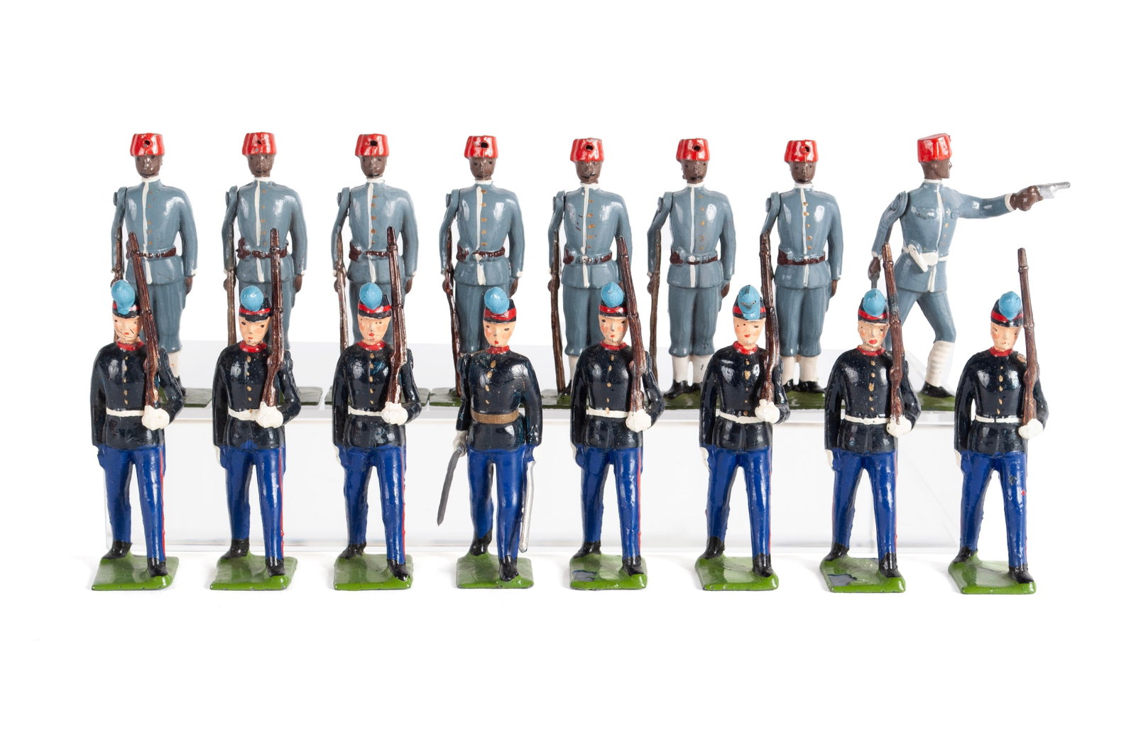 TWO SETS OF BRITAINS LEAD TOY SOLDIERS: TWO SETS OF BRITAINS LEAD TOY SOLDIERS Sixteen (16) pieces total, including a set of eight (8) Uruguayan cadets, #2051, in original box, and a set of eight (8) Egyptian infantrymen, #117, in original 