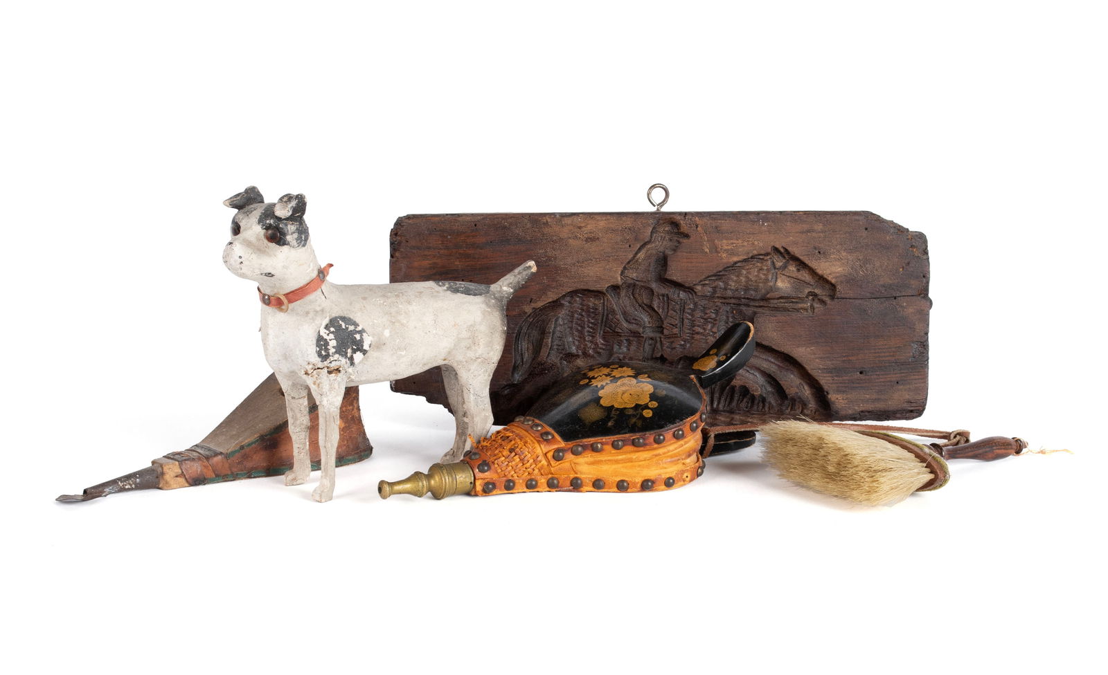 FIVE FOLK ART ITEMS: FIVE FOLK ART ITEMSLate 19th/early 20th century. Including two (2) pair of miniature bellows, a miniature brush, a composition and stick leg dog toy and a wooden horse and jockey mold.Dog: 6 1/2 in. (