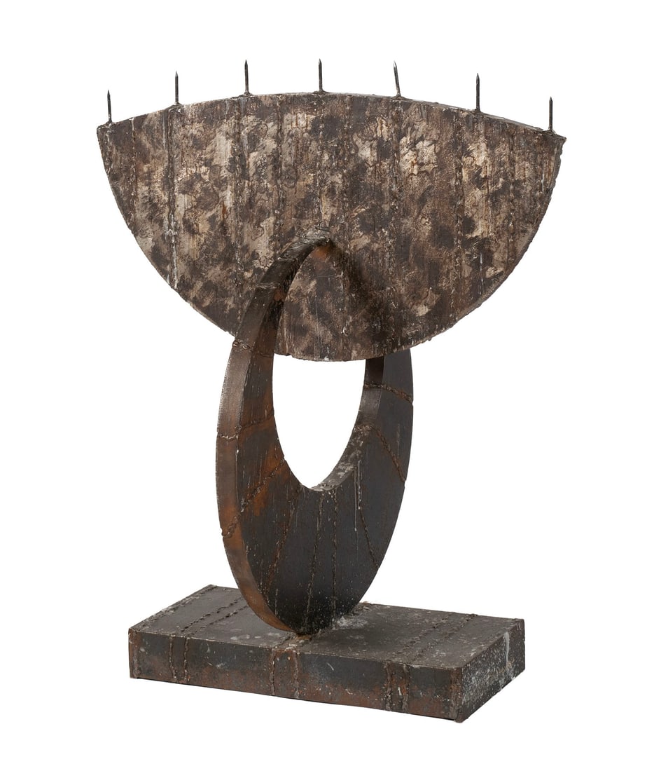 BROTHER MEL MEYER (AMERICAN (ST. LOUIS), 1928-2013): Brother Mel MeyerAmerican (St. Louis), 1928-2013SteelSigned on back of base. Brutalist seven light candelabra.Brother Mel Meyer was born in Florissant, MO in 1928 and joined the Marianist order of mon