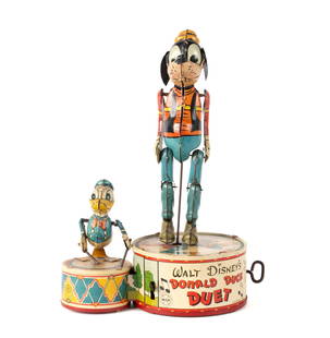 WALT DISNEY'S DONALD DUCK DUET TIN WINDUP TOY BY MARX: WALT DISNEY'S DONALD DUCK DUET TIN WINDUP TOY BY MARXAmerican, circa 1946. Donald playing a drum while Goofy dances on the taller platform.10 x 7 1/2 x 4 1/2 in. (25.4 x 19.1 x 11.4 cm.) From the life
