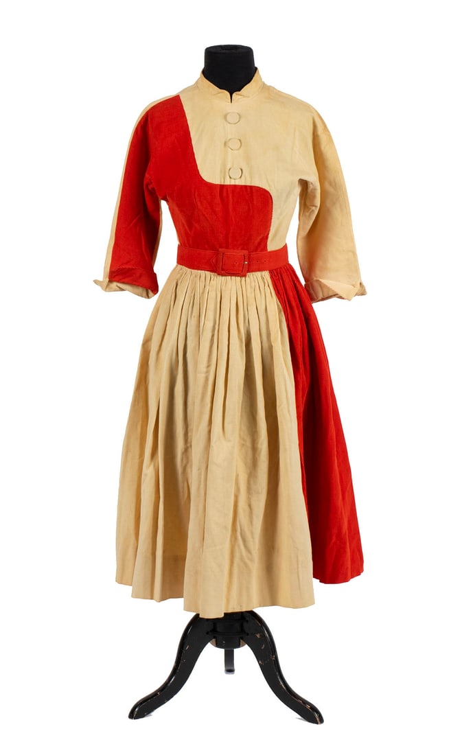 1950'S GENERAL ELECTRIC DRESS: 1950'S GENERAL ELECTRIC DRESSBelted corduroy dress worn by a model in GE advertising. Includes photocopy of an ad in which the dress design appeared. Dress was purportedly gifted from a GE employee.22