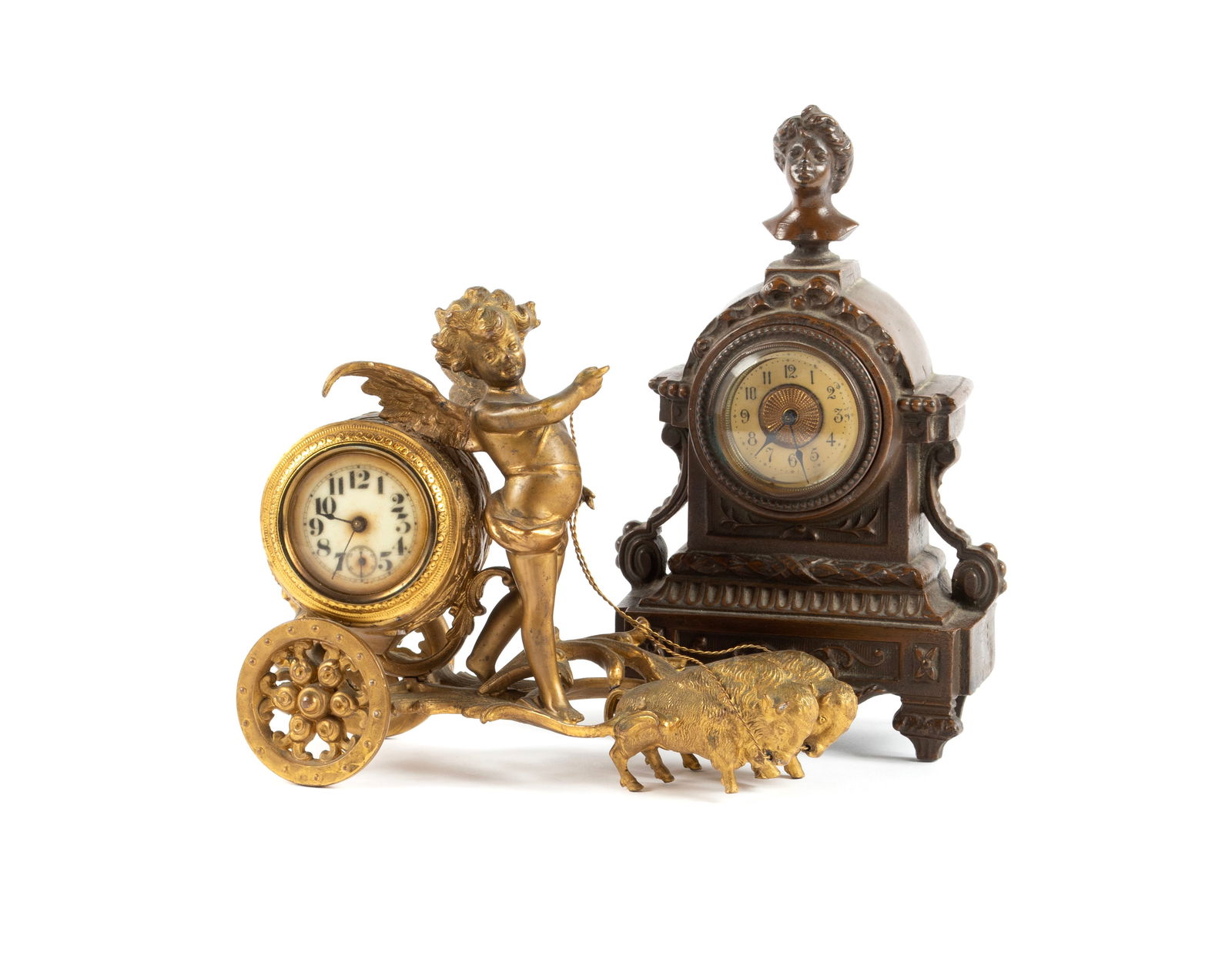 TWO DIMINUTIVE FIGURAL MANTEL CLOCKS: TWO DIMINUTIVE FIGURAL MANTEL CLOCKSContinental, circa 1900. A gilt patinated showing a winged cherub driving a chariot pulled by two bison, the cylindrical clock case set to the back. Together with a