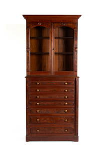 DISPLAY CABINET ON WELLINGTON CHEST: DISPLAY CABINET ON WELLINGTON CHESTAmerican, late 19th century, walnut and burl walnut. Two glazed doors cover the shelved interior, over seven long drawers with Wellington mechanism (no key).87 3/4 x