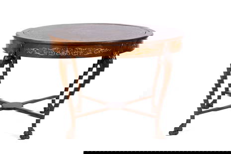 MARQUETRY FLIP TOP GAME TABLE: MARQUETRY FLIP TOP GAME TABLEContinental, 20th century. Circular top with inset central circular panel showing scrolling and foliate marquetry designs, working on a mechanism to flip over revealing a