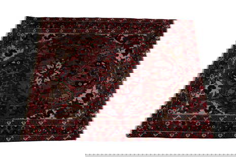 BAHKTIARI AREA RUG: BAHKTIARI AREA RUGPersian, 20th century. Large central floral medallion on the foliate decorated red field with ivory corners, red border with guard borders.5 ft. 9 in. x 5 ft. 3 in.
