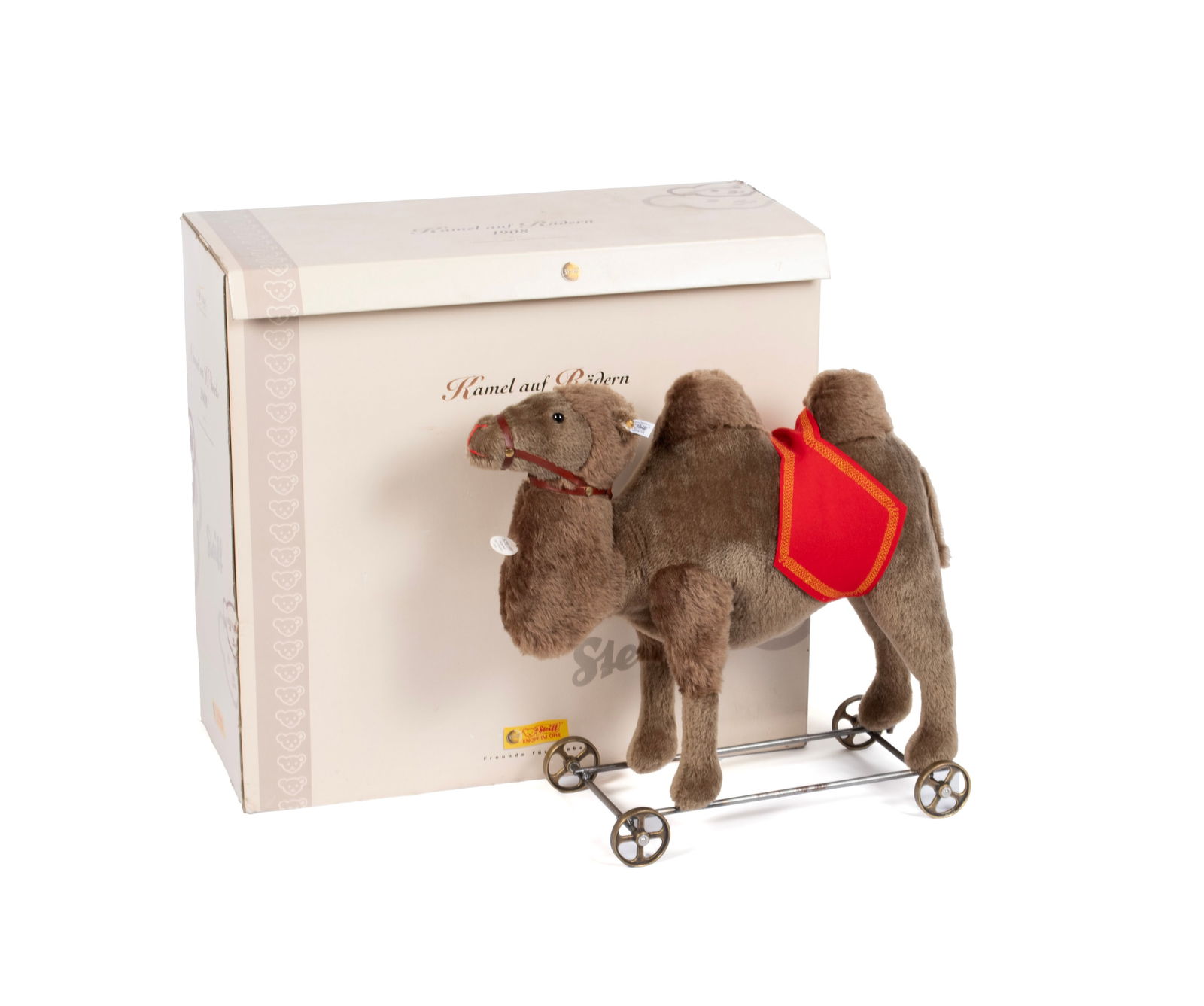 LIMITED EDITION STEIFF CAMEL IN ORIGINAL BOX: LIMITED EDITION STEIFF CAMEL IN ORIGINAL BOXGerman, 21st century. Riding toy almost like new, on wheels, with original "Zertifikat" (COA) listing the "Kamel auf Radern" as #105/1,000.21 x 21 in. (53.3