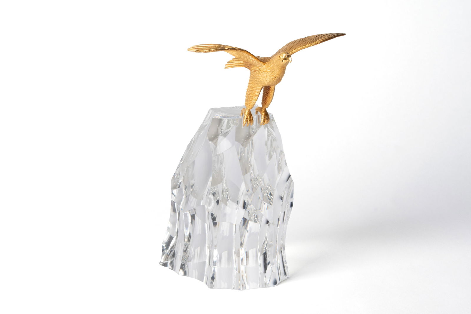 STEUBEN GLASS AND 18 KARAT GOLD "EAGLE ROCK" SCULPTURE: STEUBEN GLASS AND 18 KARAT GOLD "EAGLE ROCK" SCULPTUREAmerican, 1967. #31/50, 18K gold eagle set upon crag of cut crystal designed by James Houston. Model number X3957, eagle marked "18K S" under beak