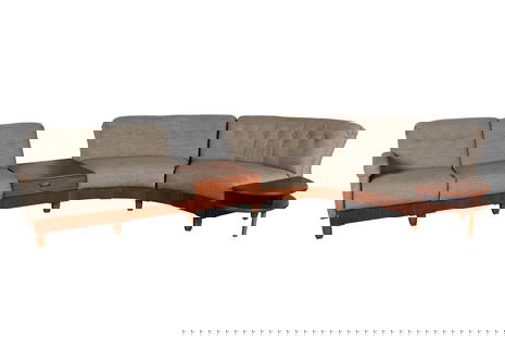 MCM SECTIONAL SOFA: MCM SECTIONAL SOFATeak Furniture Centre, Ontario, circa 1970s. Curved, upholstered sectional with built in end table with lower shelf and center table with single drawer.32 x 28 x 156 in. (81.3 x 71.1