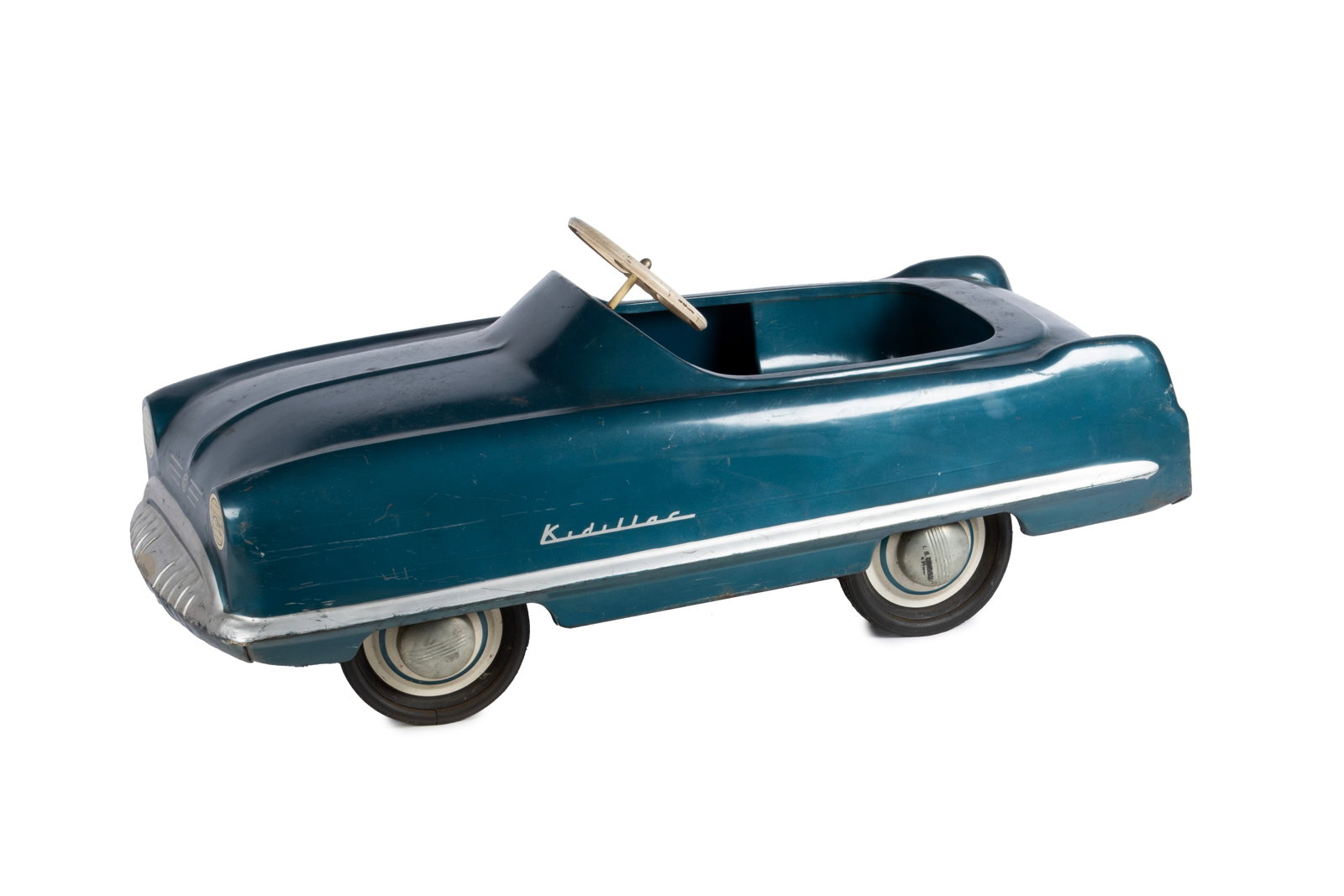 GARTON KIDILLAC PEDAL CAR: GARTON KIDILLAC PEDAL CAR American, mid-20th century. Deep blue with silver highlights including a "G" to the front grill with additional paint to the dash showing dials and switches, chain driven, wi
