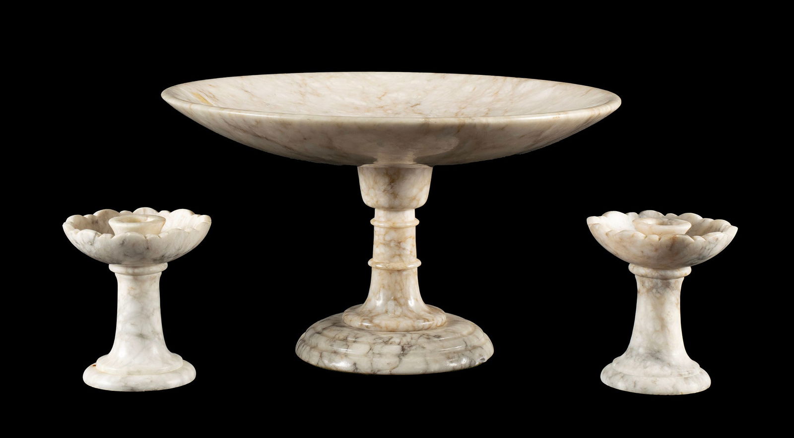 ALABASTER TAZZA AND PAIR OF CANDLESTICKS: ALABASTER TAZZA AND PAIR OF CANDLESTICKSItalian, 20th century. One (1) candlestick with Prof. Bessi label to underside.Tazza: 7 1/2 x 12 3/4 in. (19.1 x 32.4 cm.), Candlestick: 4 3/8 in. (11.1 cm.)