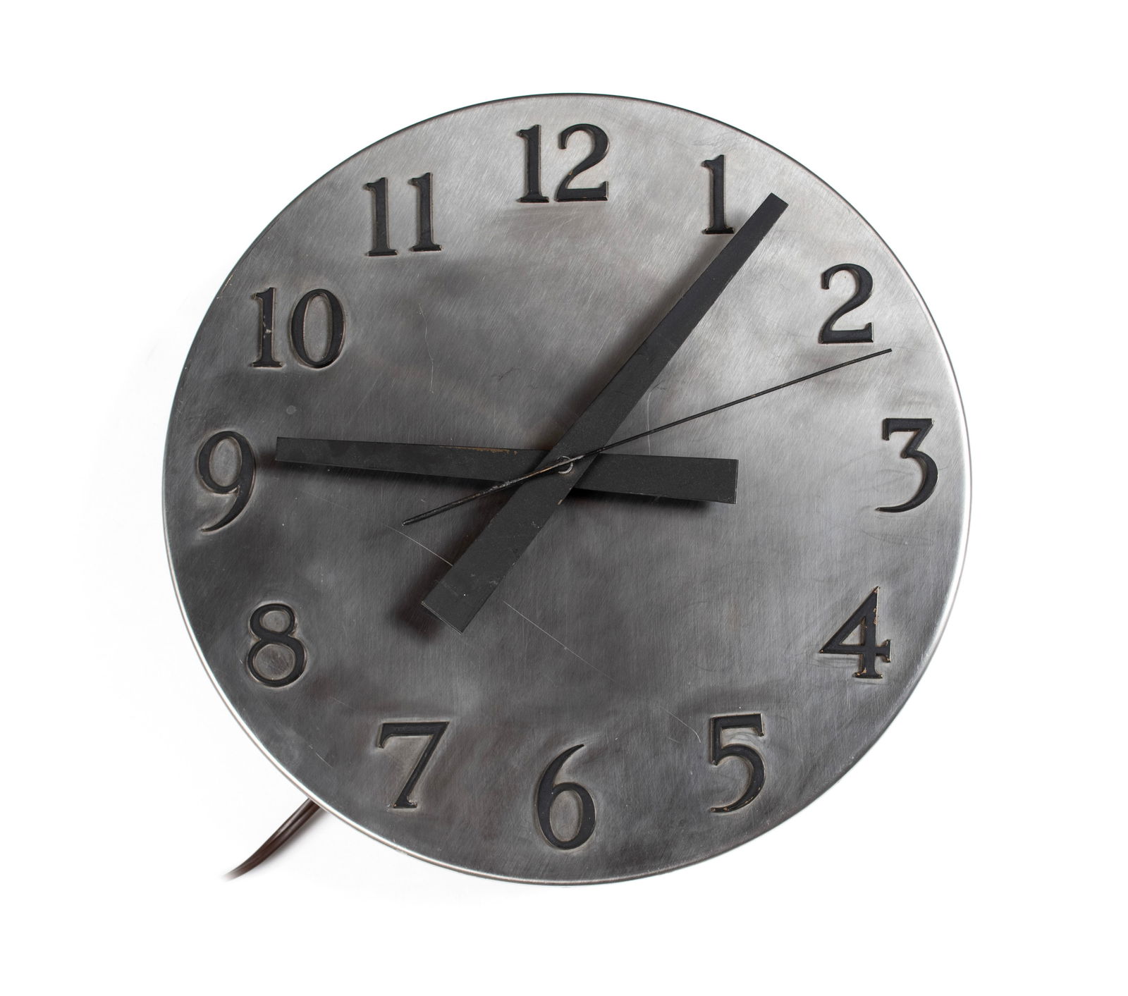 MCM INDUSTRIAL METAL WALL CLOCK: MCM INDUSTRIAL METAL WALL CLOCK20th century. Stainless steel with black hands and numbers.15 x 3 in. (38.1 x 7.6 cm.)